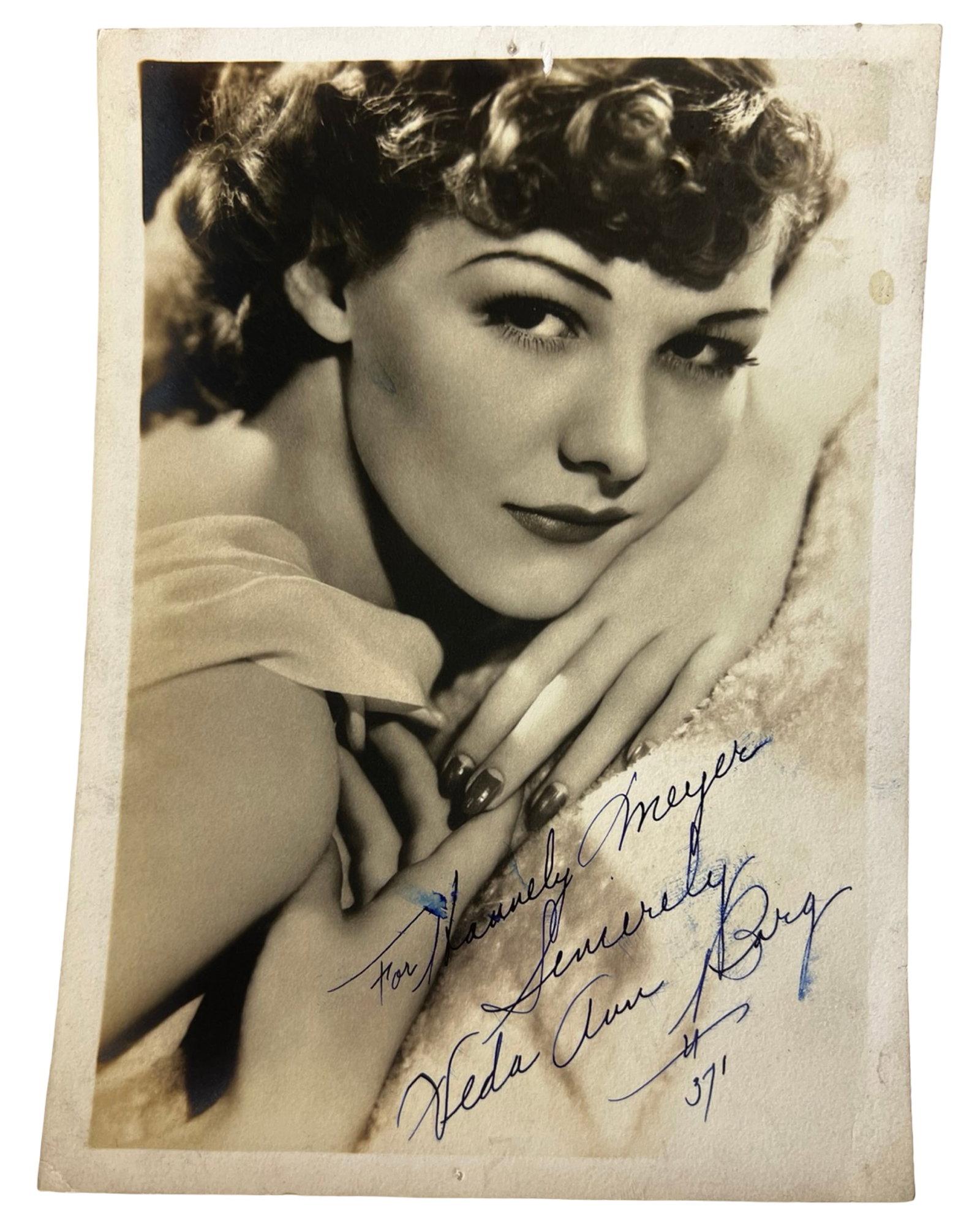 Veda Ann Borg 1930s Signed Photograph: Elegant 1930s sepia-toned photograph personally signed by Veda Ann Borg in blue ink, inscribed "For Stanley Meyer - Sincerely, Veda Ann Borg." A glamorous studio portrait showcasing the classic Hollyw