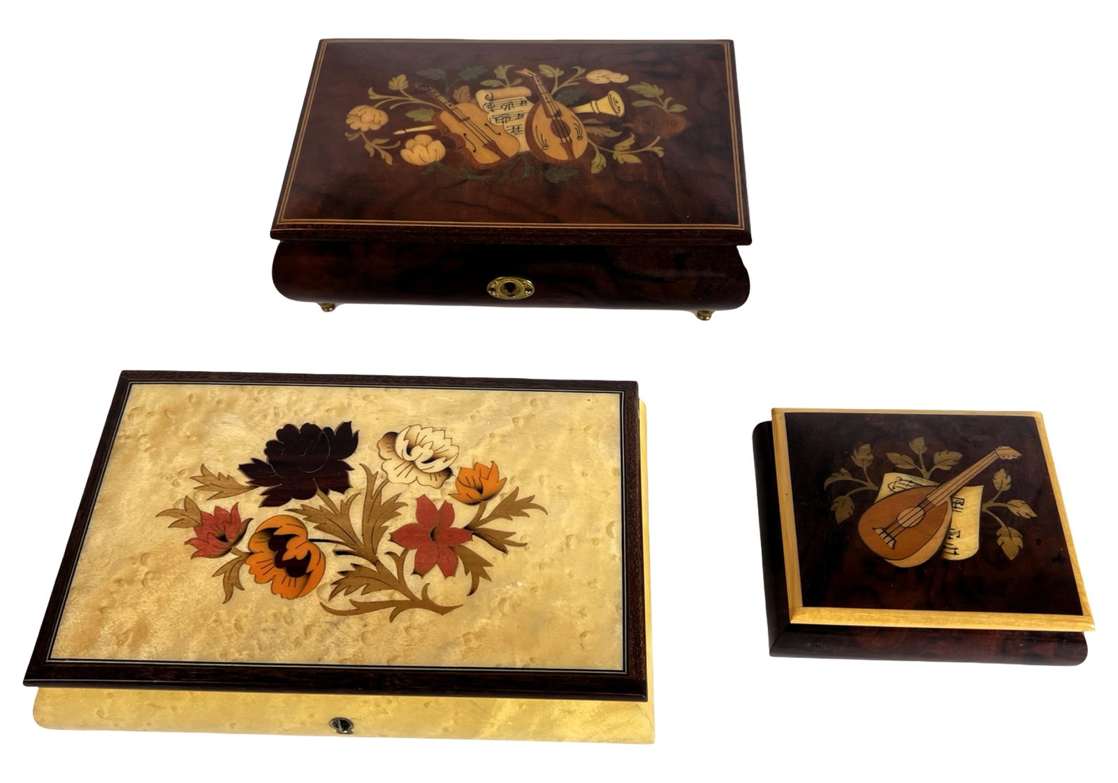 Italian Inlaid Wood Musical Jewelry Boxes w Reuge: Group of three finely crafted Italian inlaid wood musical jewelry boxes, each showcasing detailed marquetry with floral and musical motifs. These elegant boxes are fitted with Swiss Reuge musical move
