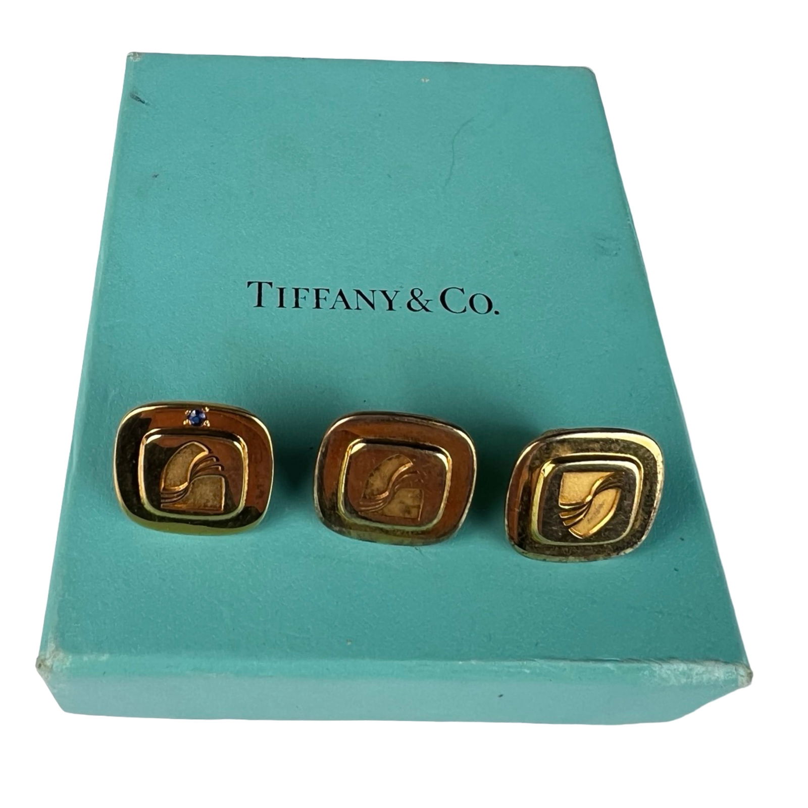 Tiffany & Co Sterling Seabourn Club Tie Tacs: Set of three Tiffany & Co. Seabourn Club Cruises tie tac pins, crafted in gold over sterling silver. Each features the Seabourn crest design, with one pin accented by a blue sapphire stone. Comes hous