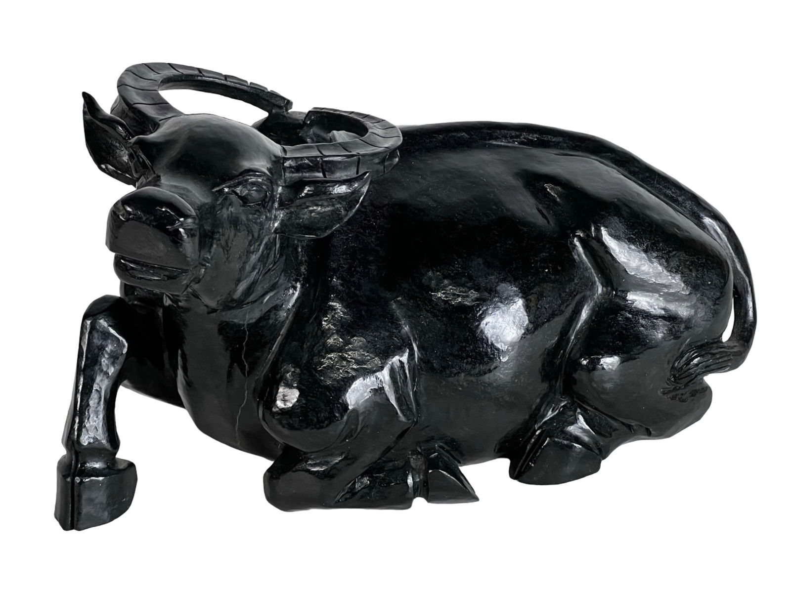 Asian Carved Black Marble Water Buffalo Sculpture: Impressive and weighty sculpture of a reclining water buffalo, hand-carved from solid black marble. The piece features a highly polished surface with subtle natural veining and mineral inclusions char