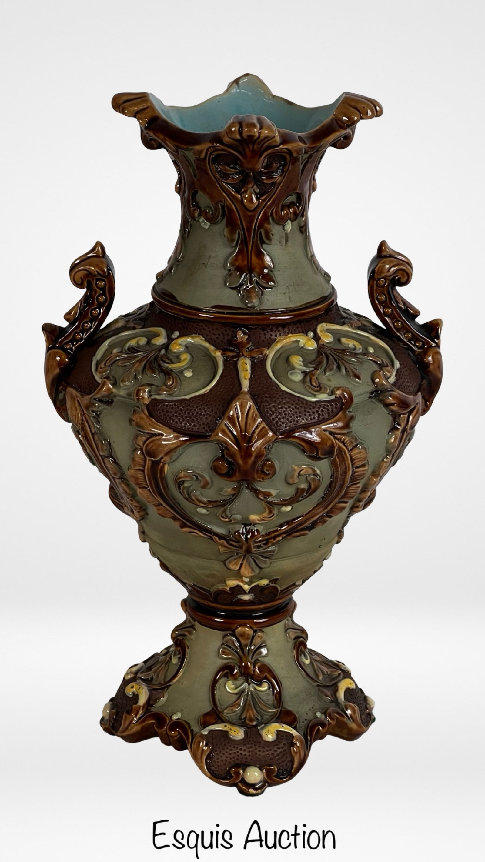 Wilhelm Schiller Austrian Antique Majolica Vase: Striking late 19th-century majolica vase by Wilhelm Schiller & Son of Austria, showcasing a bold Roman amphora form with ornate high-relief barbotine decoration. The sculpted design features curling