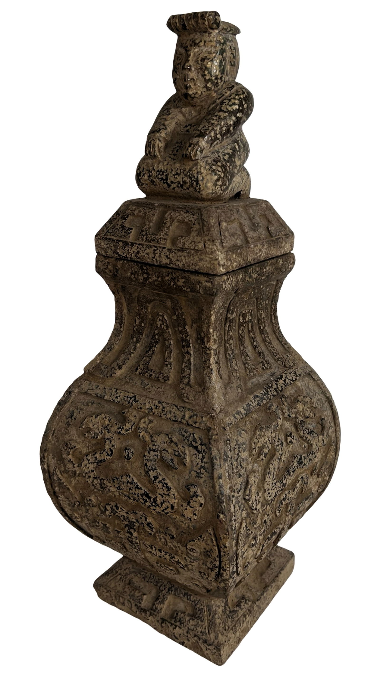 Chinese Earthenware Covered Vase - Figural Finial: This richly textured Chinese earthenware vessel features a bold architectural form with flared body, squared base, and a stepped lid topped with a seated figural finial. Intricate raised patterns