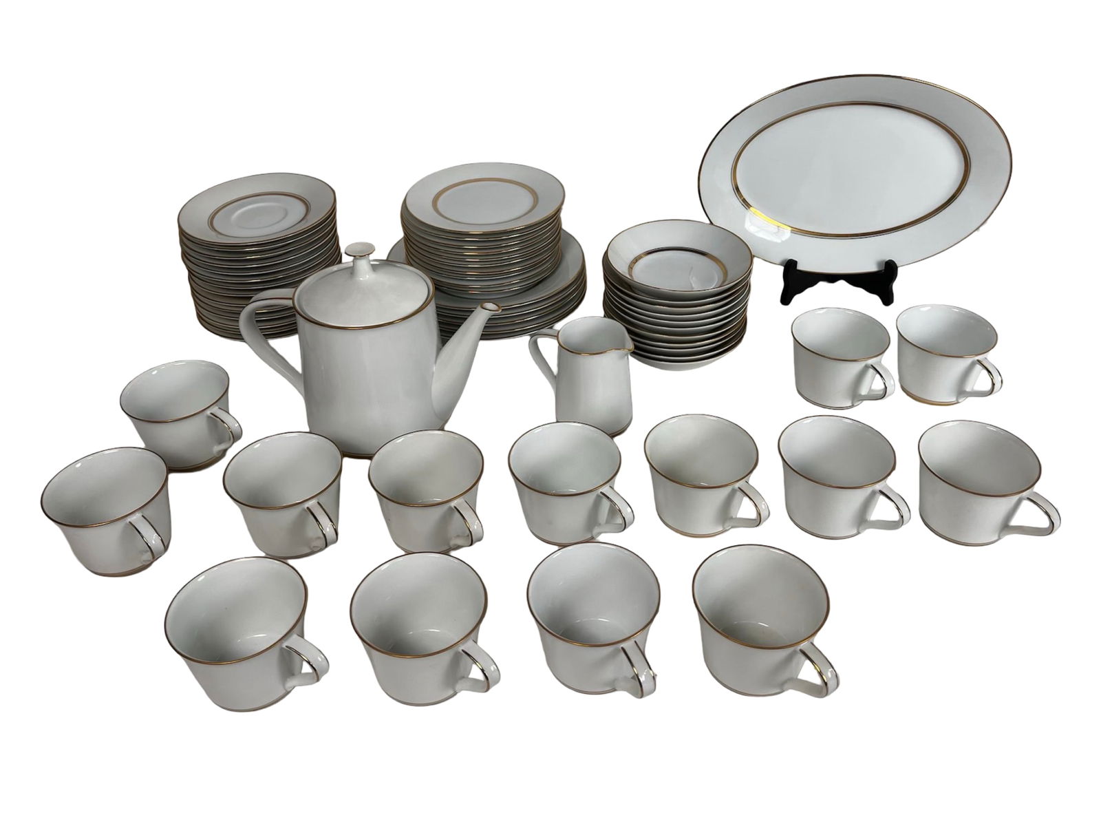 Noritake "Gloria" 6526 Porcelain Dinnerware Set: This is a 45-piece Noritake porcelain dinnerware set in the classic "Gloria" pattern (6526), made in Japan. Each piece features an elegant white body with a fine gold trim. The set includes 14 cups,