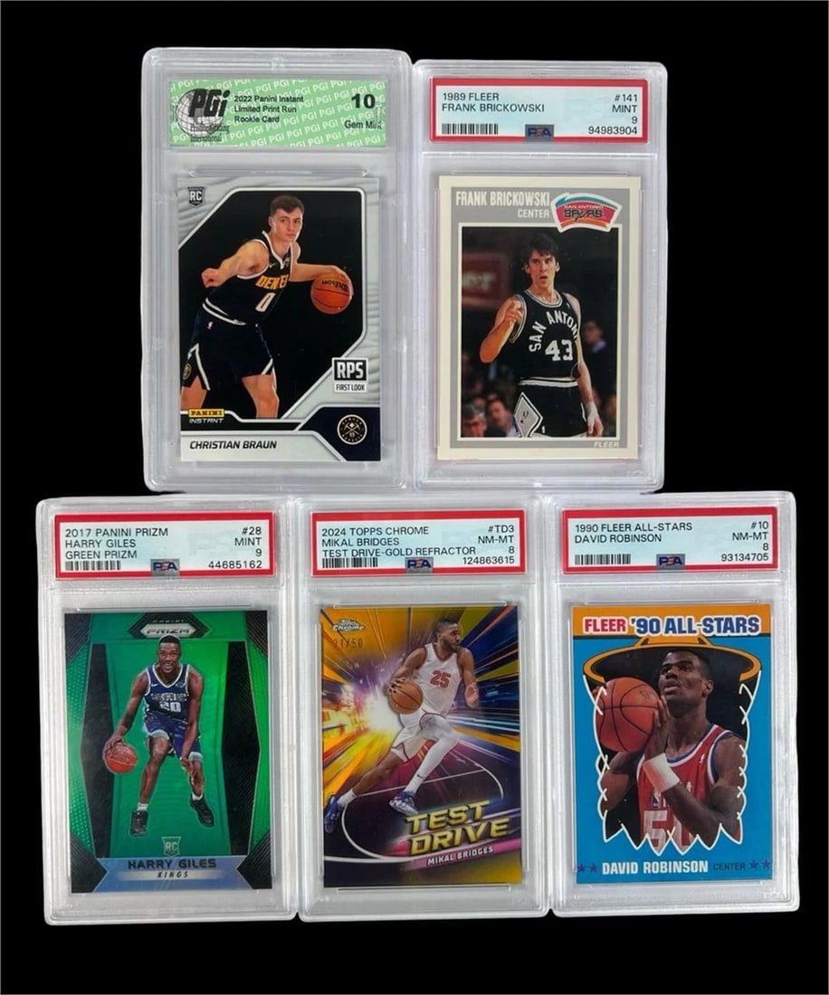 PSA Graded Basketball Cards- Robinson, Brickowski: Five graded basketball cards featuring a mix of rookies, inserts, and vintage favorites. Includes a 2022 Panini Instant Christian Braun Rookie (PGI Gem Mint 10), 1989 Fleer Frank Brickowski (PSA 9),