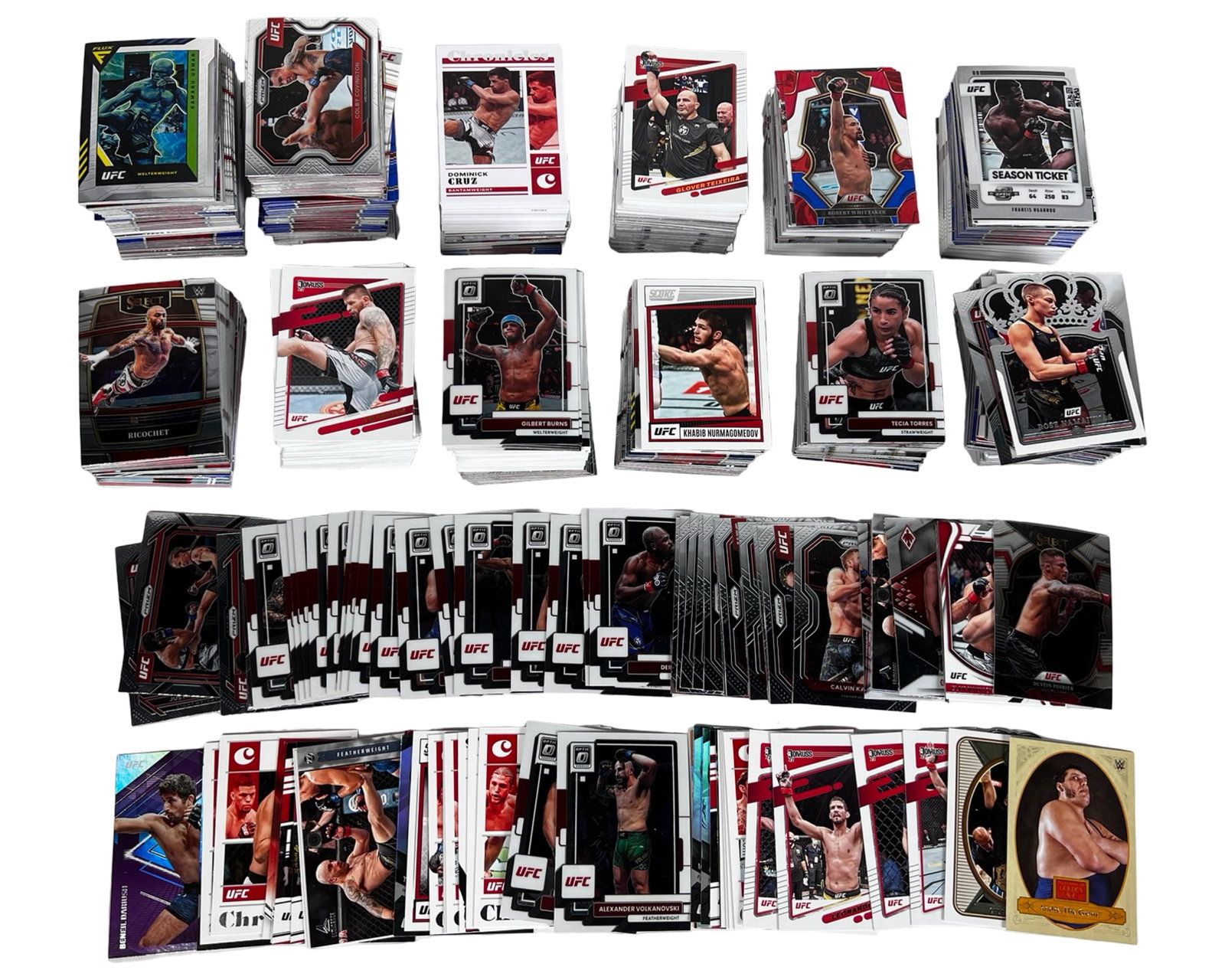 Large Collection of UFC & Wrestling Trading Cards: Extensive assortment of UFC and WWE trading cards. Lot includes a wide mix of fighters, action poses, and card types across various sets and brands such as Donruss, Select, Chronicles, and Crown Royal