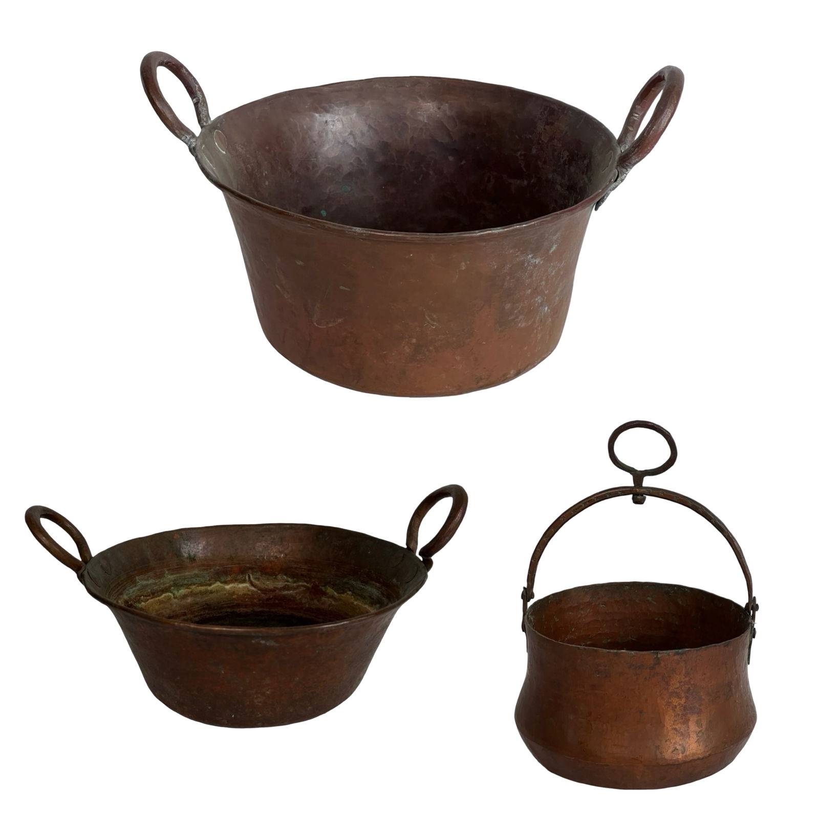 Antique Hand-Hammered Copper Cauldrons and Pots: Charming set of three antique copper vessels, each hand-forged and showcasing a rich patina from decades of use. The grouping includes two wide-lipped cauldron-style pots with large riveted ring handl