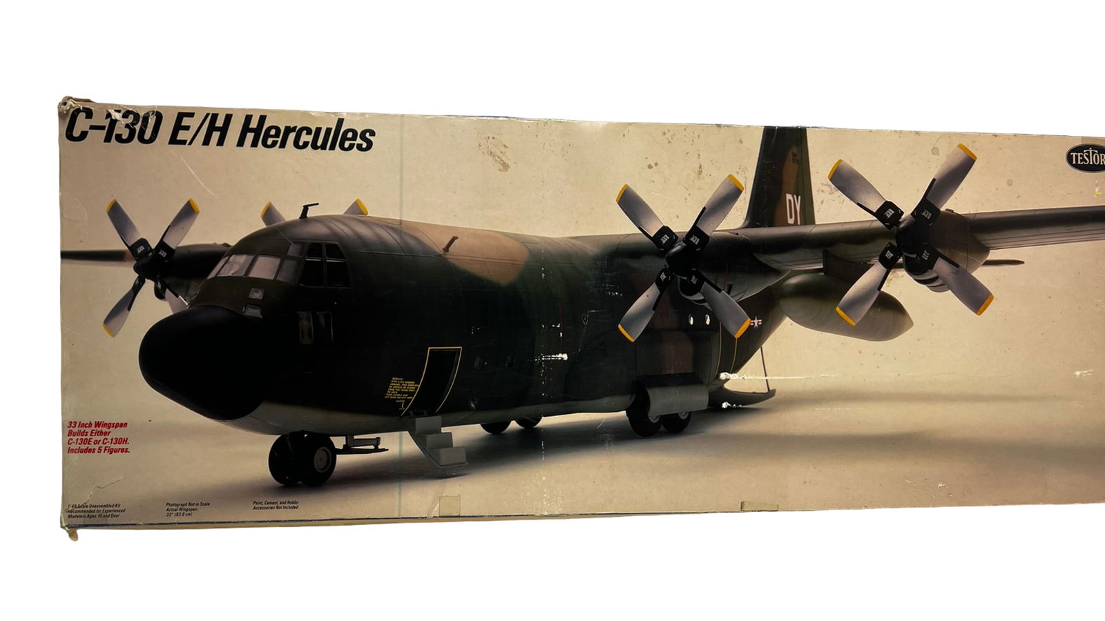Testors 1/48 Scale C-130 Hercules Model Kit: Unassembled plastic model kit of the C-130 E/H Hercules military transport aircraft by Testors in 1/48 scale. Includes aircraft parts with 33" wingspan, decal sheet, instruction manual, and five crew