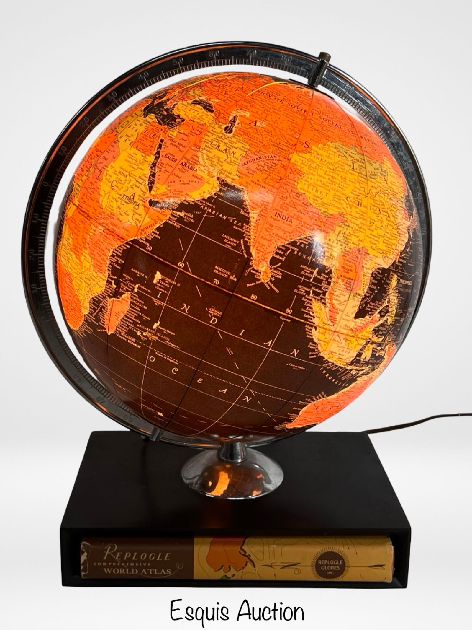 Vintage Replogle Starlight Illuminated World Globe: Vintage 12-inch illuminated terrestrial globe by Replogle Globes Inc., featuring raised relief topography and detailed political boundaries. Set in a rotating metal meridian and wood base with built-i