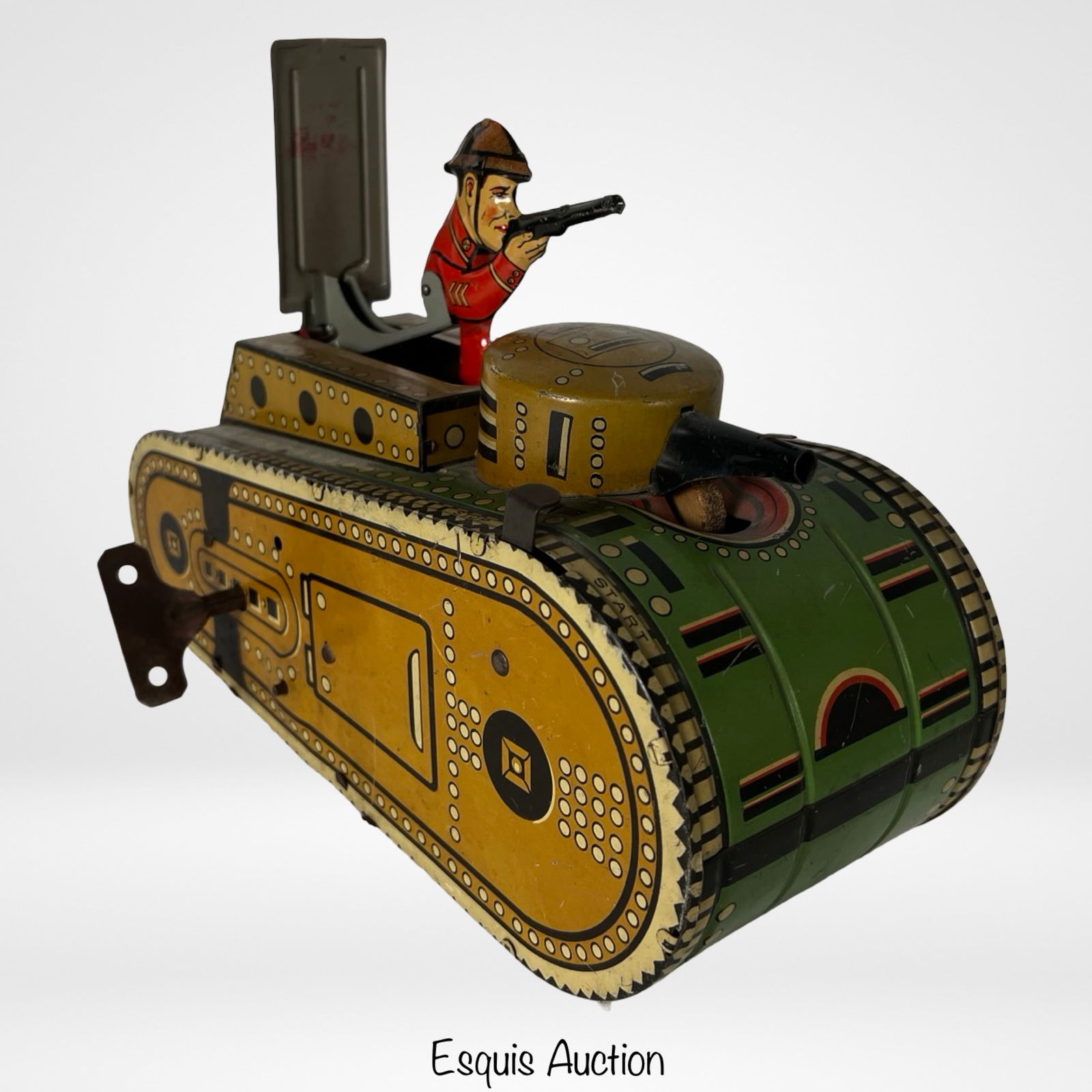 Vintage Marx Tin Litho Wind-Up Tank with Soldier: olorful vintage tin lithographed wind-up tank by Marx Toys, marked "Made in USA" and "Pat's Pendg." Features a painted soldier figure in red uniform and helmet holding a rifle, positioned in the open