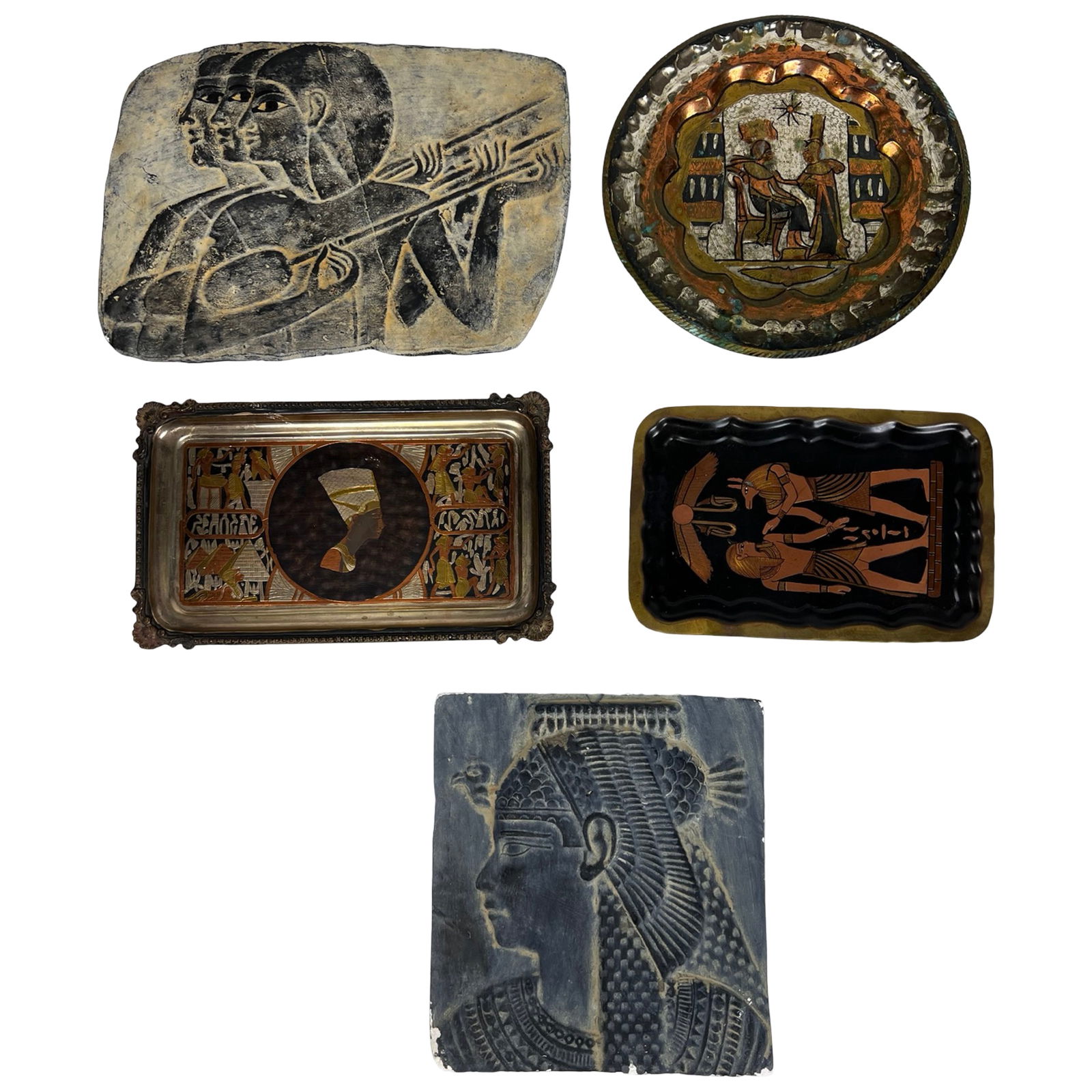 Egyptian Themed Decorative Wall Art and Trays: This eclectic collection of Egyptian themed decorative objects draws inspiration from ancient Egyptian art, symbolism, and mythology. The group includes a variety of wall plaques and trays rendered