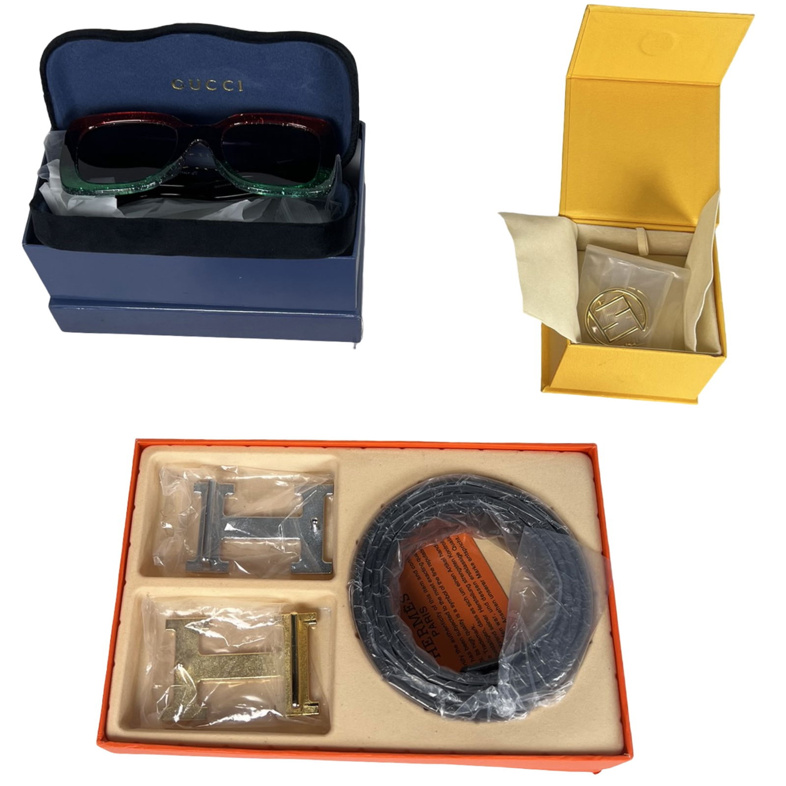 Fashion Accessories- Sunglasses, Belt, & Earrings: Stylish set of lady's fashion accessories including a bold pair of oversized sunglasses with gradient frames, a fashionable faux-leather belt with two interchangeable metallic "H" style buckles, and a