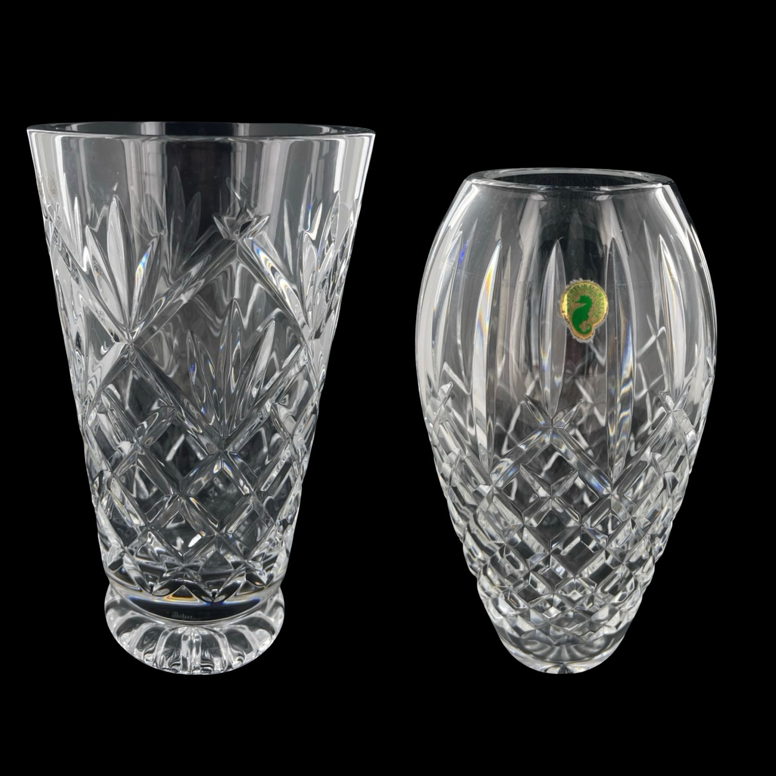 Waterford Crystal Innisfree & Araglin Vases: Elegant pair of Waterford Crystal cut glass vases featuring two distinct and highly regarded patterns. The taller vase is the Innisfree pattern, standing approximately 10 inches tall, with crisp verti