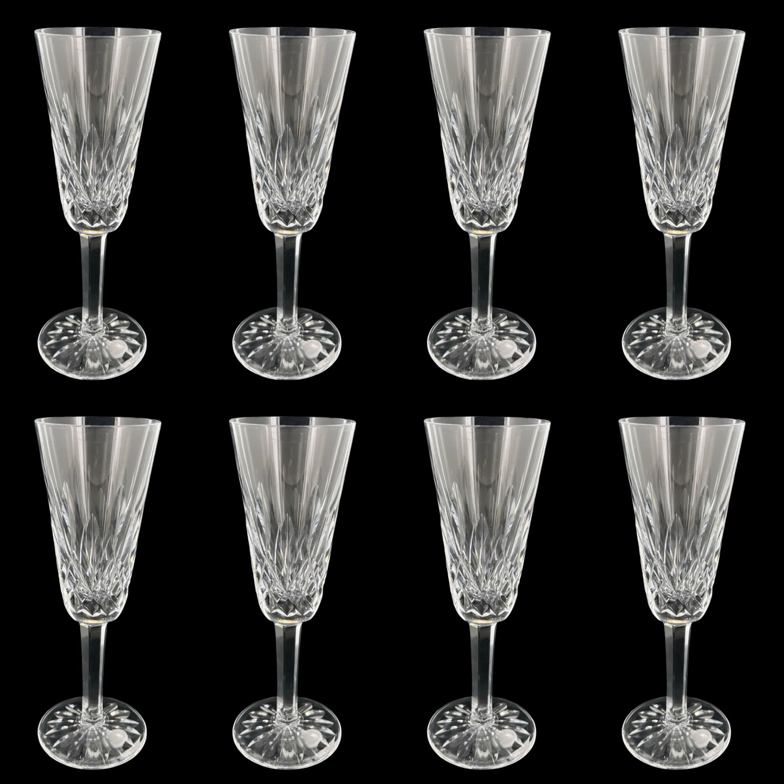Waterford Crystal Lismore Champagne Flutes- 8: Classic set of eight Waterford Crystal champagne flutes in the iconic Lismore pattern. Each flute features sharply defined diamond and wedge cuts that create exceptional brilliance and clarity,