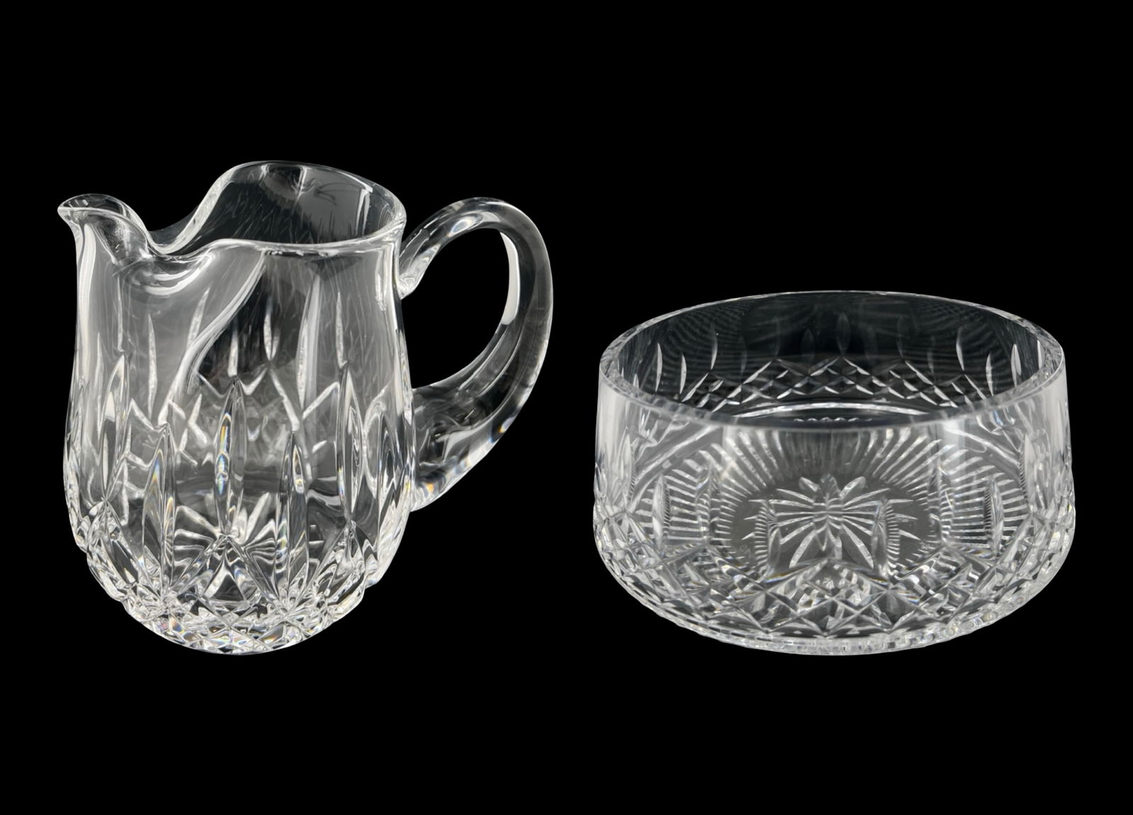 Waterford Crystal Lismore Ice Lip Pitcher and Bowl: Elegant Waterford Crystal grouping featuring a classic Lismore pattern ice lip pitcher paired with a matching crystal bowl. Both pieces display the iconic diamond and wedge cuts that define the