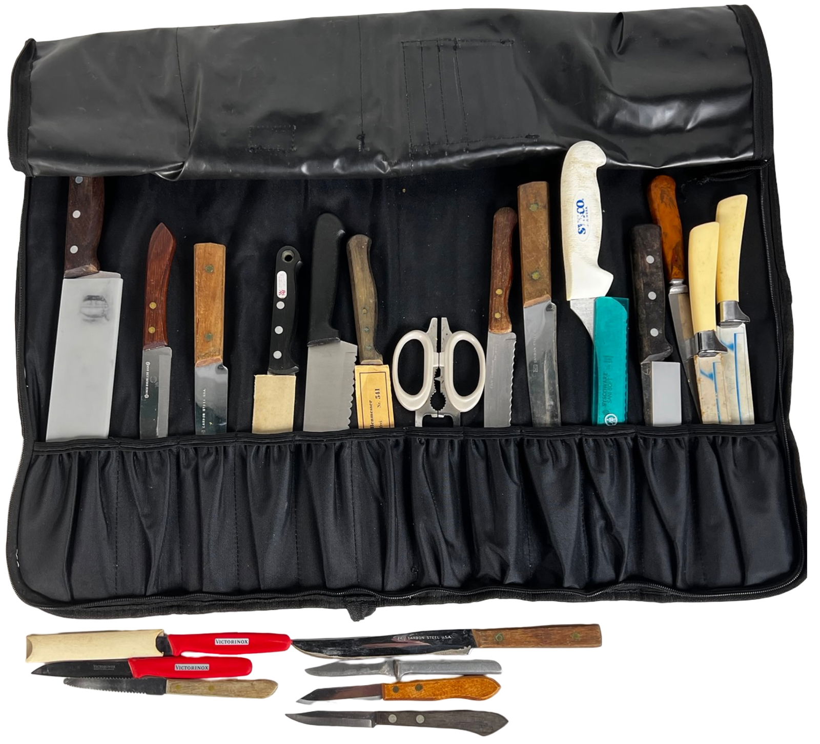 Wusthof Roll-Up Knife Bag with Kitchen Knives: This lot includes a Wusthof roll-up knife bag with an assorted group of kitchen knives, shears, and culinary tools.The contents consist of a mixed selection of knives in various sizes and blade styles
