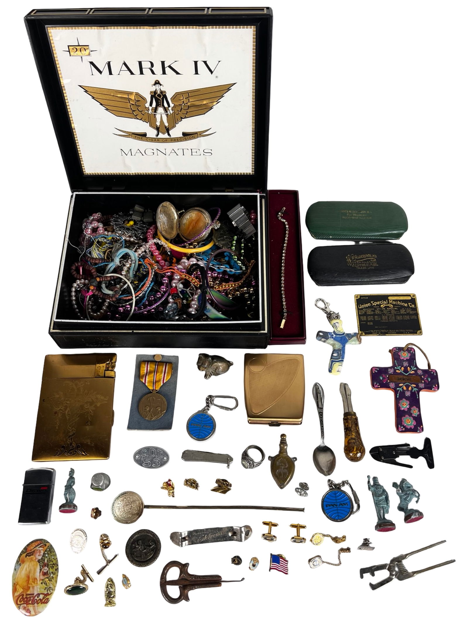 Eclectic Junk Drawer Lot: Jewelry, Tokens, Lighter: A true time-capsule assortment pulled straight from a vintage "junk drawer," packed into a Mark IV Magnates cigar box. This mixed lot includes everything from costume bracelets, old medals, cufflinks,
