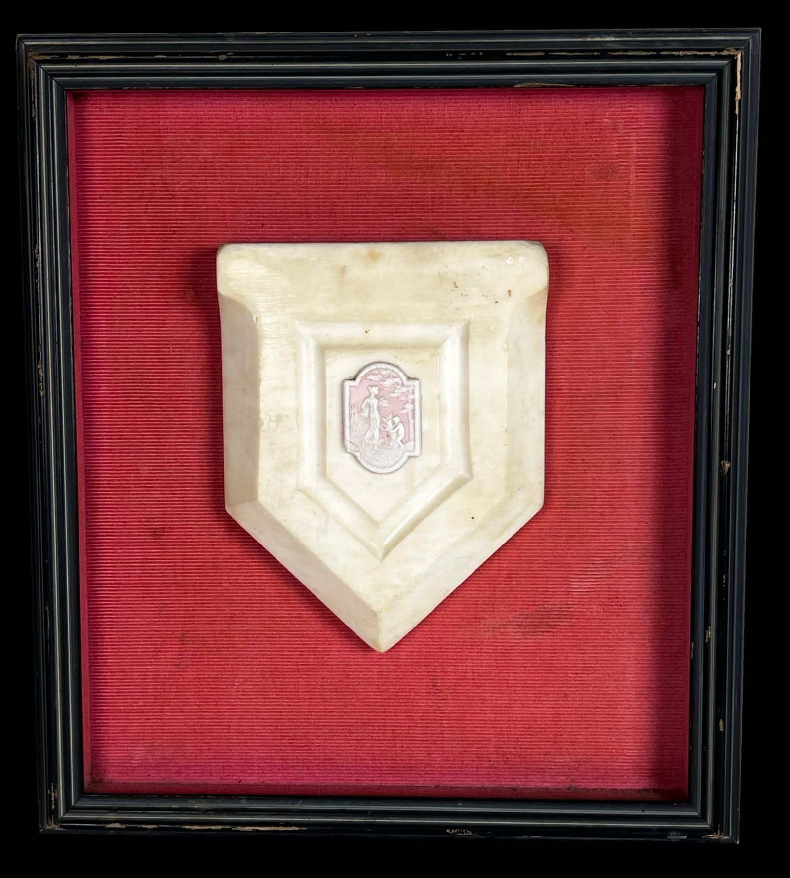 Antique English Pink Jasperware Plaque on Marble: This refined antique English pink jasperware plaque features a delicately modeled classical scene in low relief, depicting standing and kneeling figures set within a pastoral landscape. Rendered in