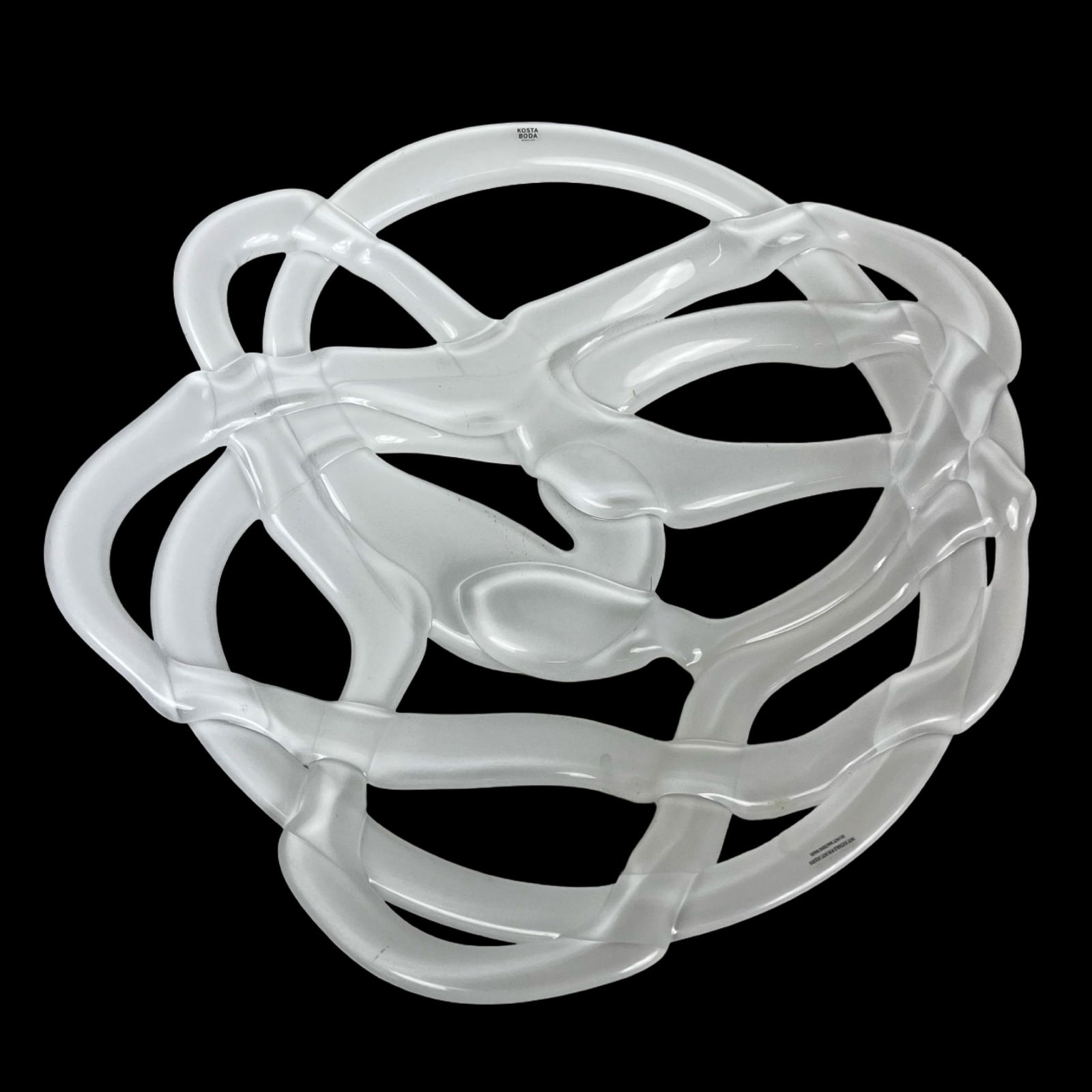 Kosta Boda Anna Ehrner Twisted Opaque Glass Basket: Sculptural basket bowl designed by Anna Ehrner for Kosta Boda, executed in hand-formed opaque art glass. The design features an open, interlaced web structure with flowing, ribbon-like elements that c
