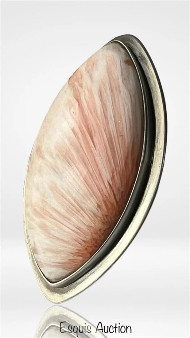 Striking Sterling Silver Scolecite Ring: Make a bold impression with this eye-catching handcrafted ring featuring a marquise-shaped scolecite cabochon, bezel-set in solid sterling silver. The stone displays soft feather-like striations in bl