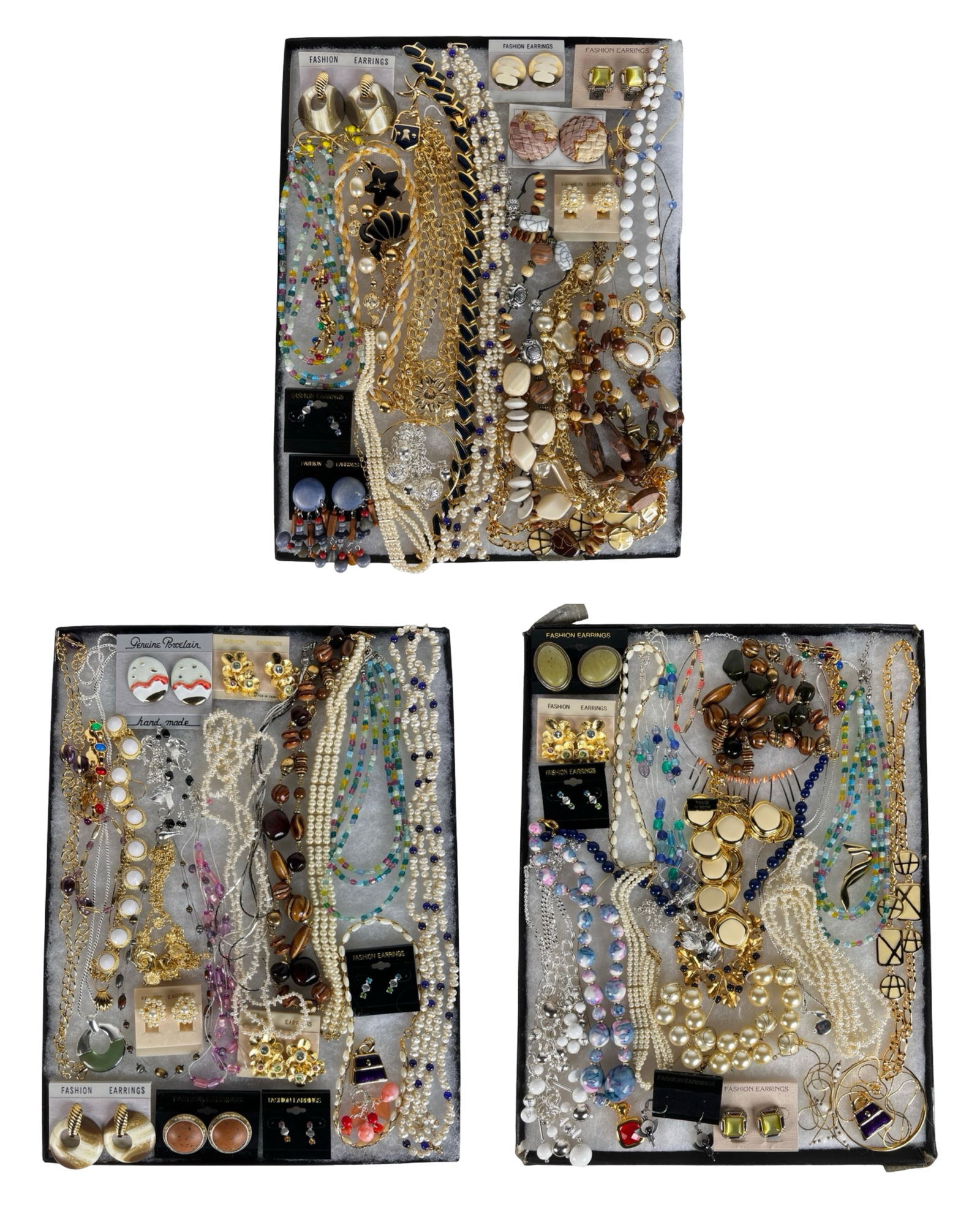 Colorful & Sparkling Assortment of Costume Jewelry: A colorful and sparkling assortment of costume jewelry featuring a mix of necklaces, earrings, bracelets, and other stylish accessories. This diverse grouping offers plenty of shine and versatility, s