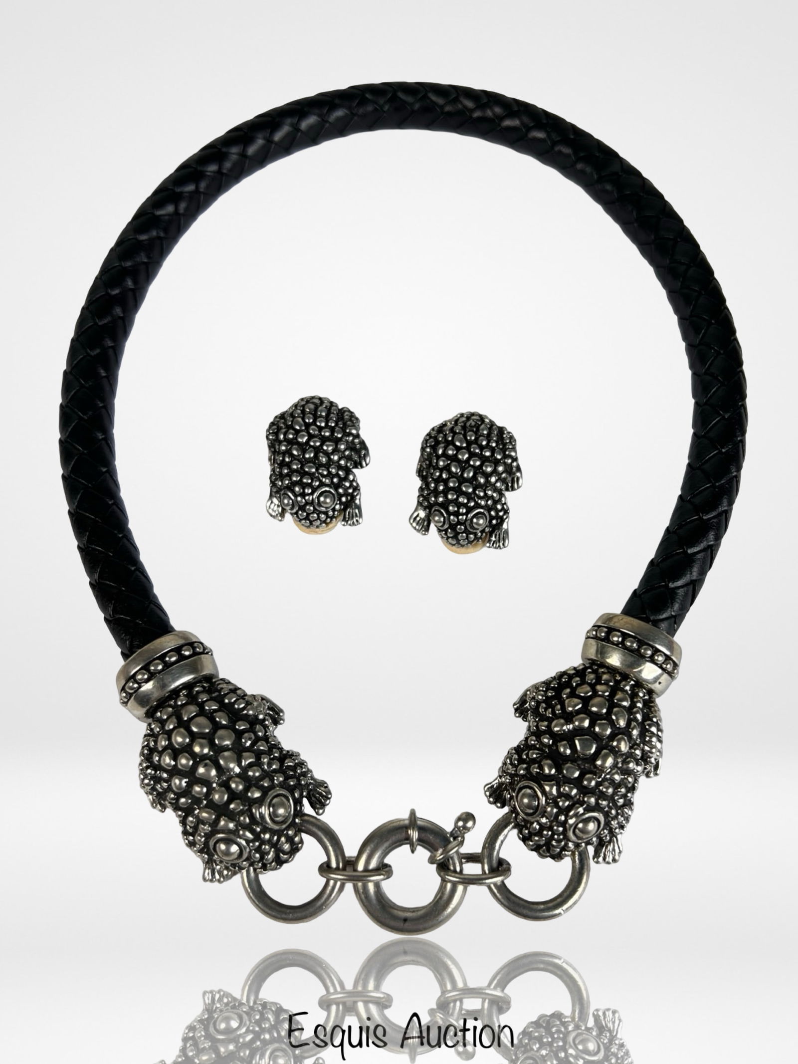 Cabot Statement Frog Mesh Choker Necklace Set: Cabot Statement Frog Mesh Choker Necklace with Matching Frog Clip-On EarringsWhimsical and bold, this statement set features a black woven choker accented with textured silver-tone frog terminals,