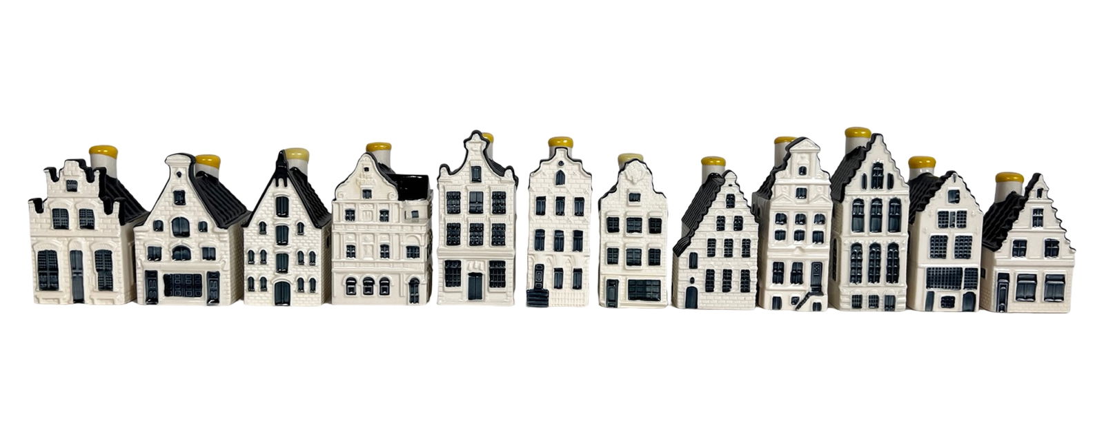 KLM Delft Blue Canal House Miniature Houses: harming collection of Delft Blue miniature house bottles produced for KLM by Bols, inspired by historic Dutch canal houses and architectural landmarks. Each ceramic miniature represents a real
