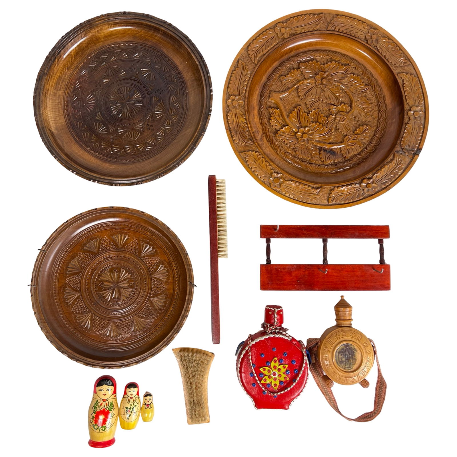 European Folk Art Carved Wood Plates & Decor Acce: A charming assortment of European traditional folk art featuring hand-carved wooden plates with detailed geometric and floral motifs, showcasing warm patina and craftsmanship. The group also includes