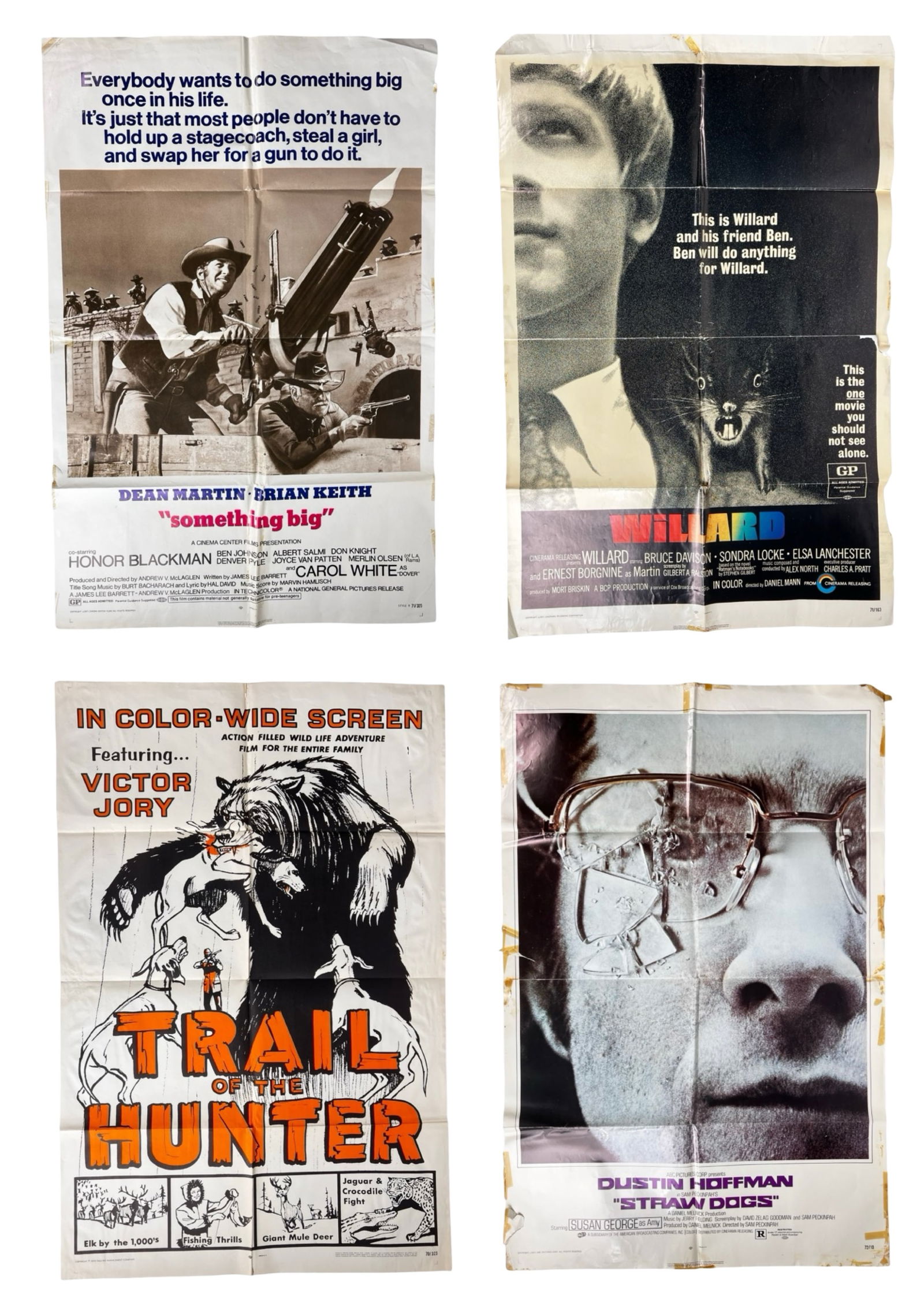 Four Original Vintage Movie Posters: Group of four original theatrical movie posters featuring Something Big (1971), Willard (1971), Trail of the Hunter (1959), and Straw Dogs (1971). The posters show typical theater-use wear, including