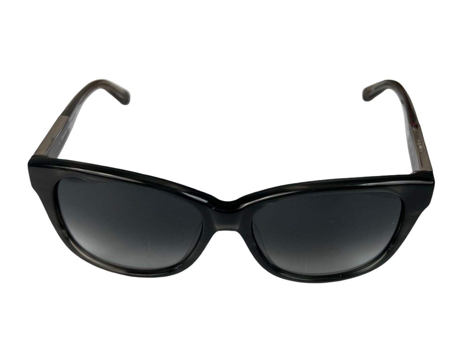 Calvin Klein CK78995 Designer Sunglasses: Sleek designer sunglasses by Calvin Klein, model CK78995, featuring a streamlined black frame with softly contoured lenses for a modern, understated look. The minimalist design reflects the brand's si