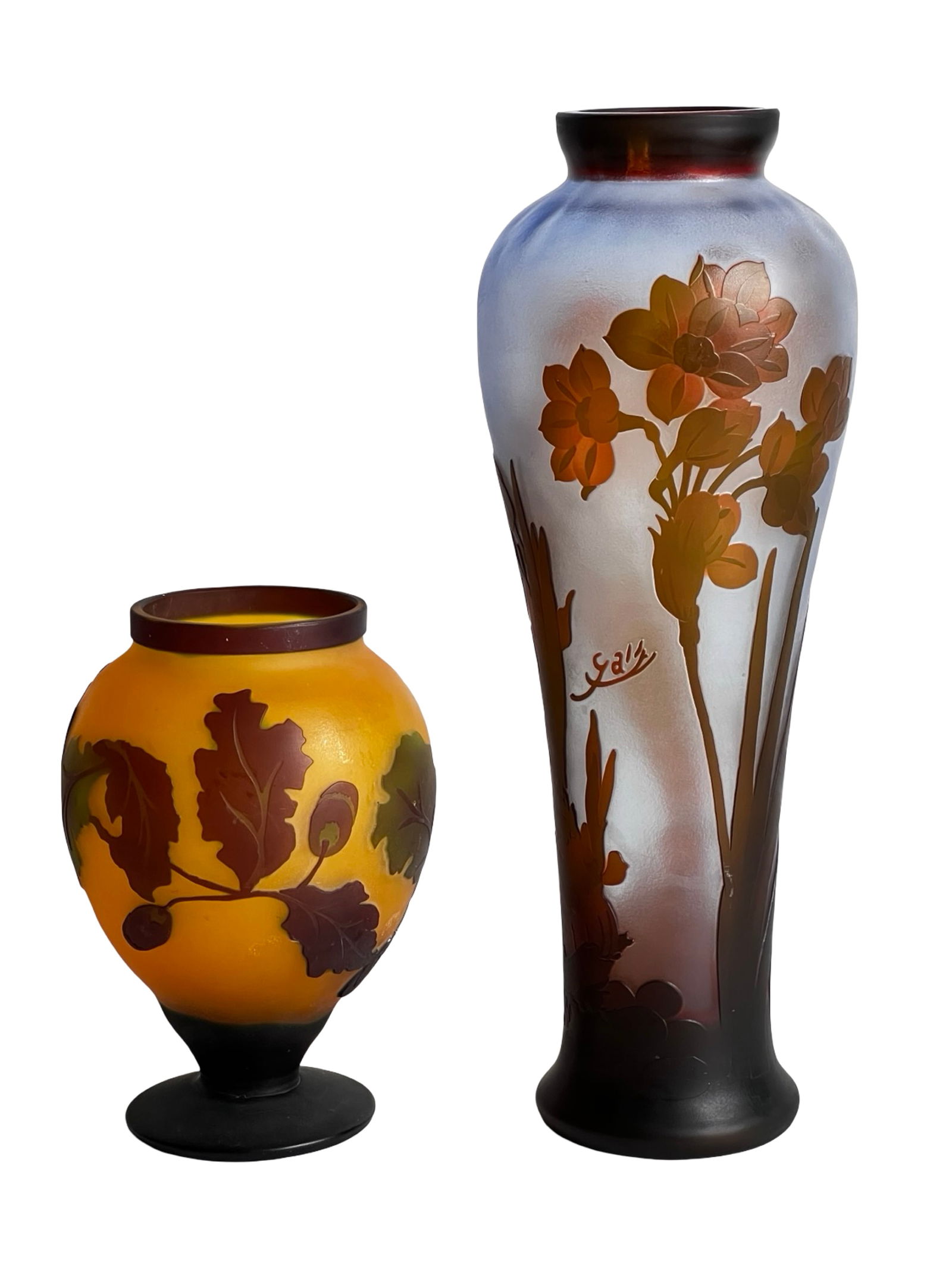 Art Nouveau Cameo Glass Vases After Emile Galle: Elegant pair of Art Nouveau style cameo art glass vases inspired by the celebrated designs of Emile Galle. Each vase features richly layered glass with acid-etched floral and foliate decoration in war