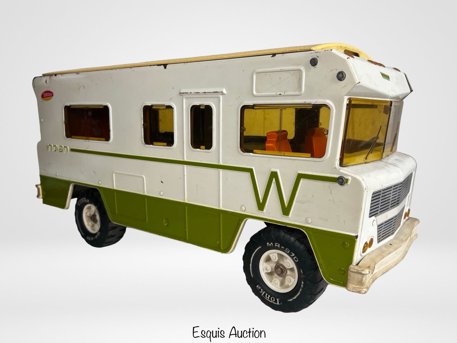 1970s Tonka Winnebago Indian RV Pressed Steel Toy: Vintage 1970s Tonka "Winnebago Indian" RV crafted in pressed steel with plastic window panels and interior details. This large-scale example measures approximately 23" x 10" x 8" and features the