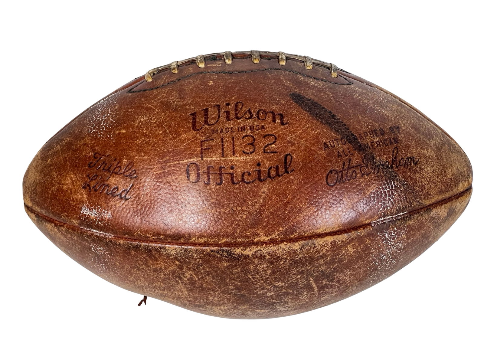 1950s Wilson F1132 Football - Otto Graham Model: 1950s Wilson F1132 "Official" size leather football, marked "Triple Lined" and bearing the facsimile signature of Cleveland Browns legend Otto Graham. This classic mid-century gridiron ball features