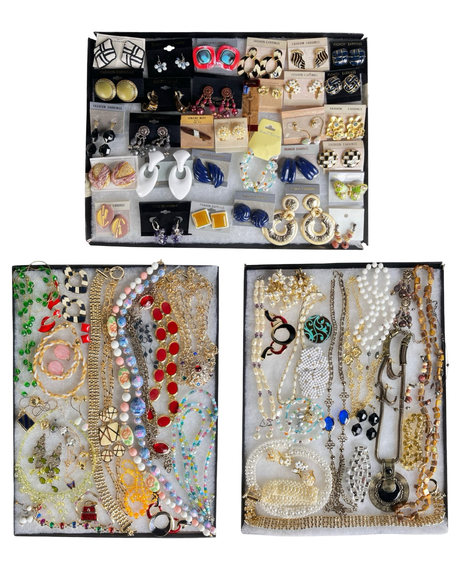 Assortment of Costume Jewelry: A vibrant selection of costume jewelry offering an eye-catching range of necklaces, earrings, bracelets, and other fashionable accents. This varied group provides plenty of shimmer and style for