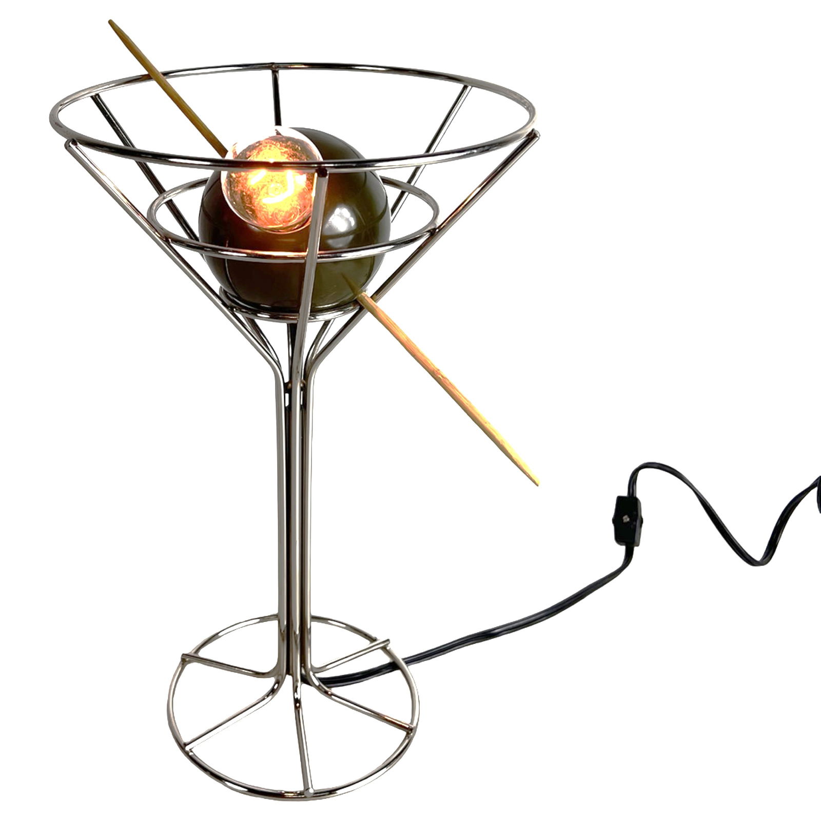 1993 David Krys Postmodern Martini Lamp: Striking postmodern table lamp designed by David Krys in 1993, playfully modeled in the form of an oversized martini glass. The chrome-finished metal "glass" frame supports a central olive form pierce