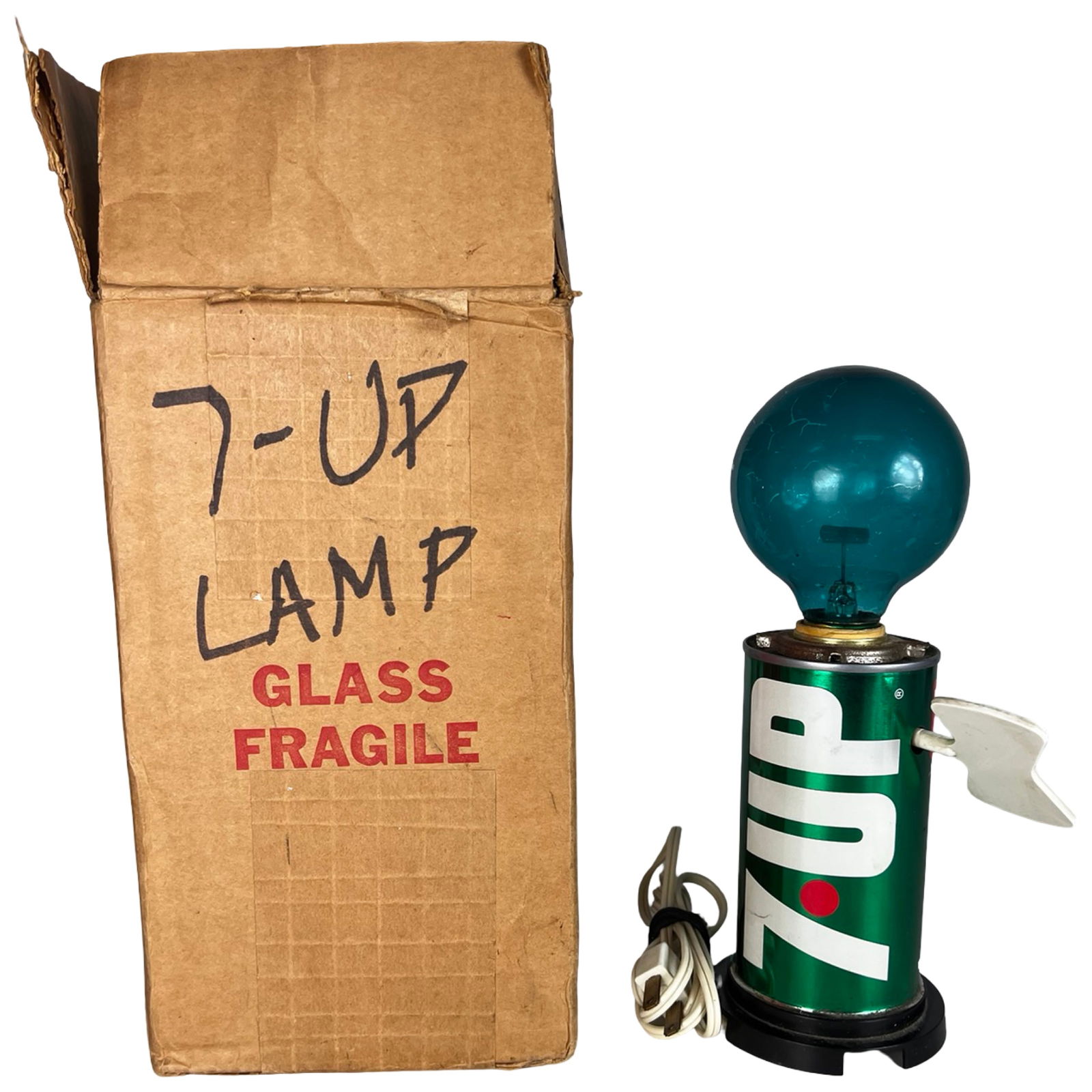 1970 7UP "The Uncola" Flicker Soda Can Lamp: Vintage 1970 7-Up Flicker motion lamp featuring the iconic green soda can base with bold white logo and red dot detail. The lamp is topped with a blue-green glass globe containing a curved internal