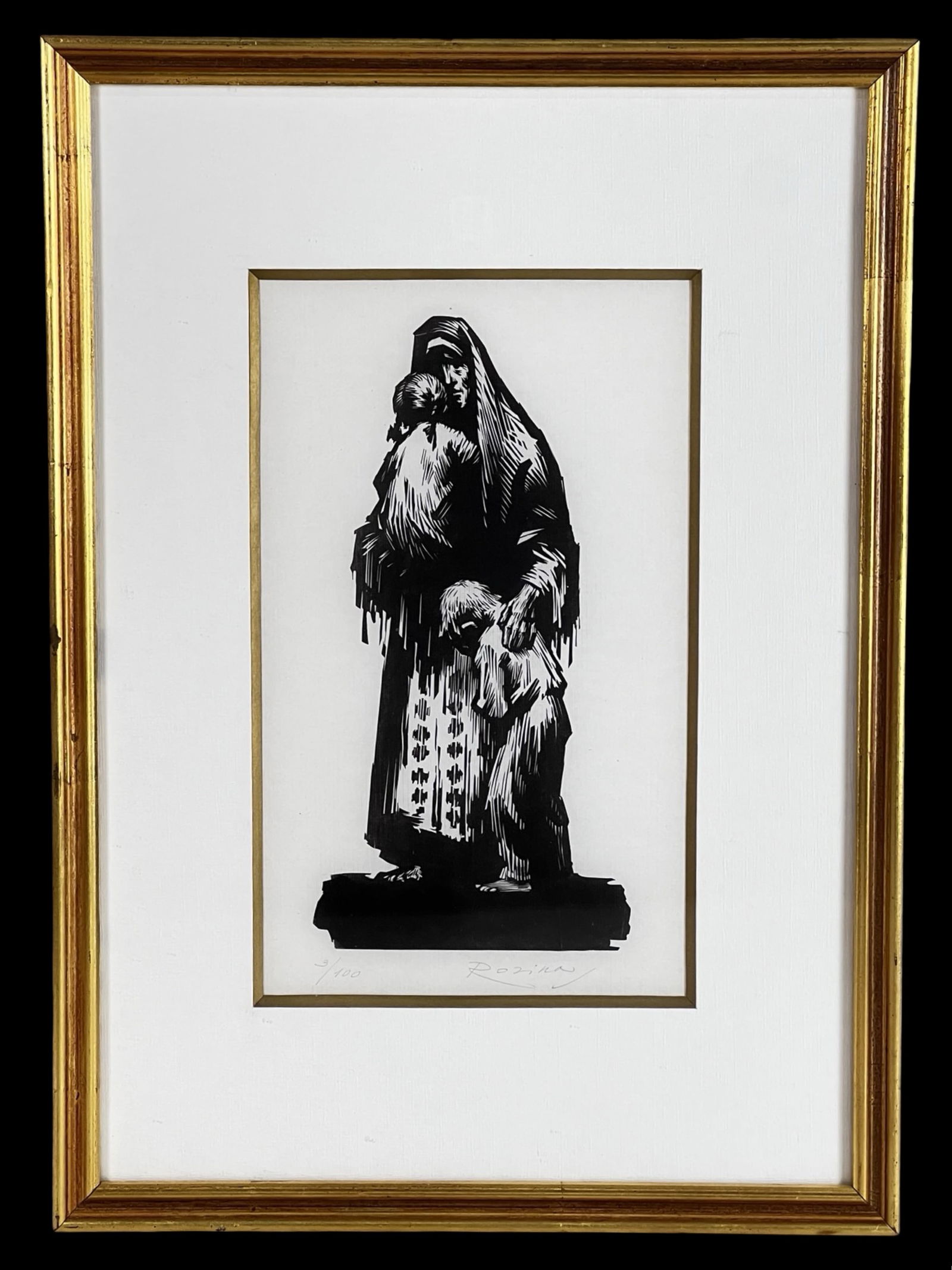 Samuel Rosin- Mother and Children Signed Woodcut: Striking black and white woodcut by Samuel Rosin depicting a solemn mother holding one child while another stands at her side. The composition is rendered in bold, expressive cuts with strong contrast