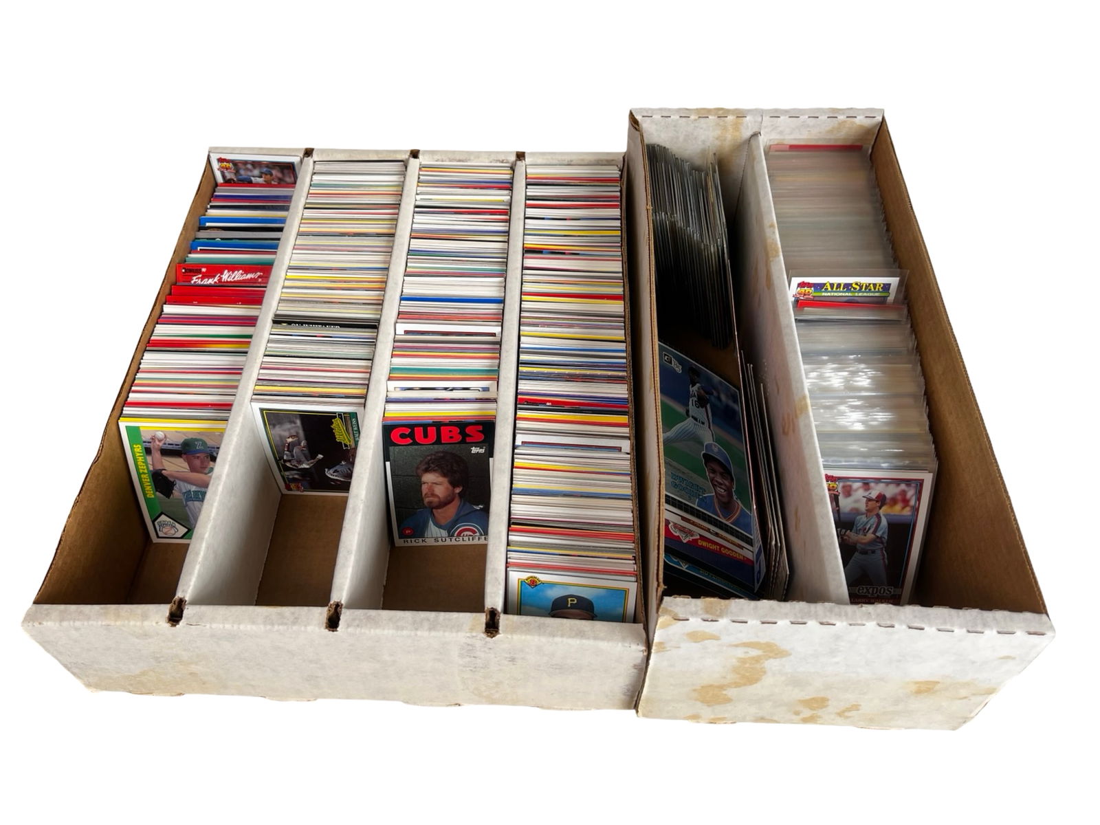 Large Unsearched Vintage Baseball Card Collection: Extensive unsearched collection of vintage baseball cards housed in two long storage boxes. The boxes are well filled and contain a substantial quantity of cards spanning primarily the mid-1980s