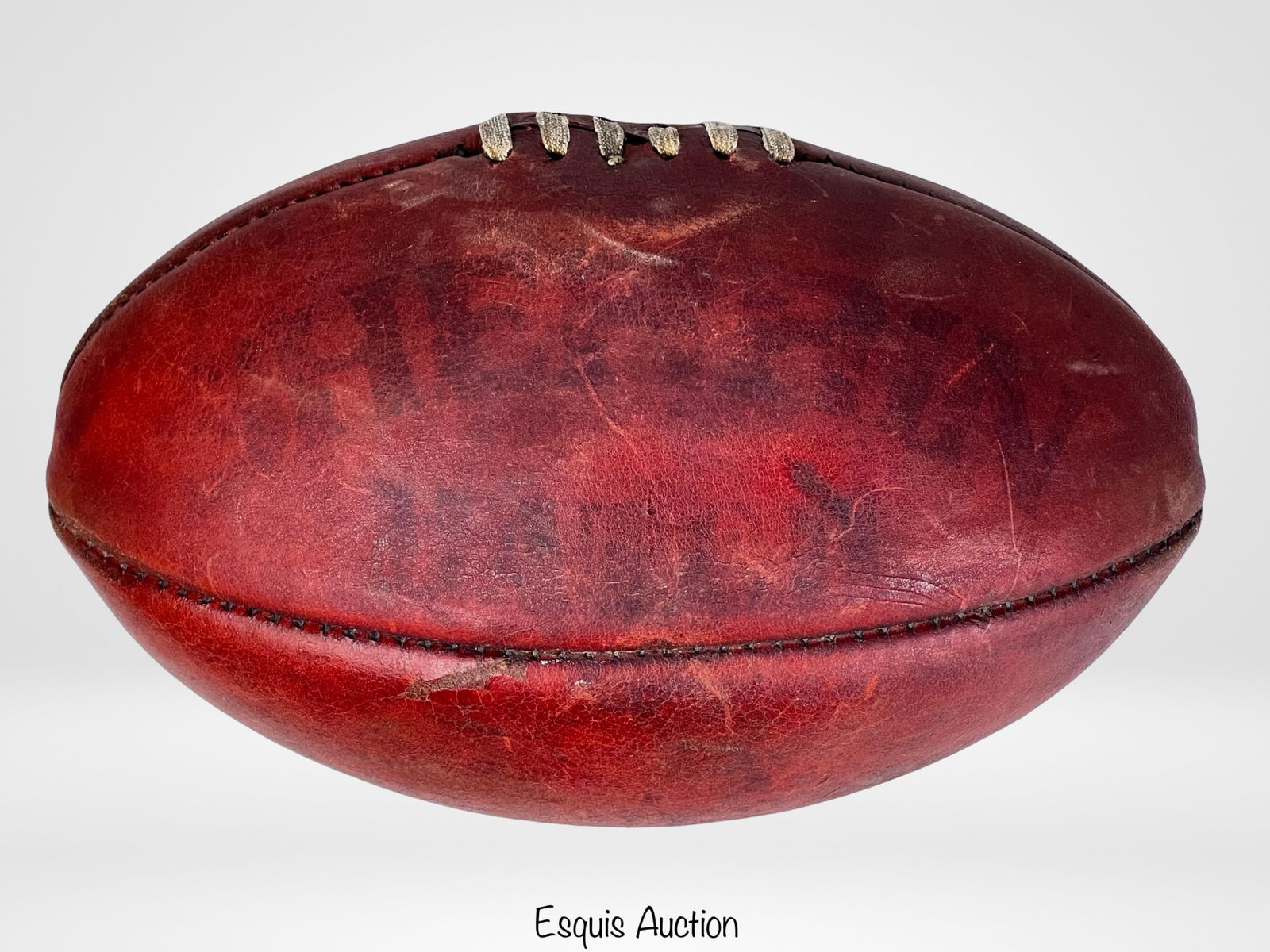 Antique 1920s Sherrin Match Leather Rugby Ball: Antique Sherrin match rugby ball dating to the 1920s, crafted from rich brown leather with classic paneled construction and original lace-up seam. The ball displays a beautifully aged patina