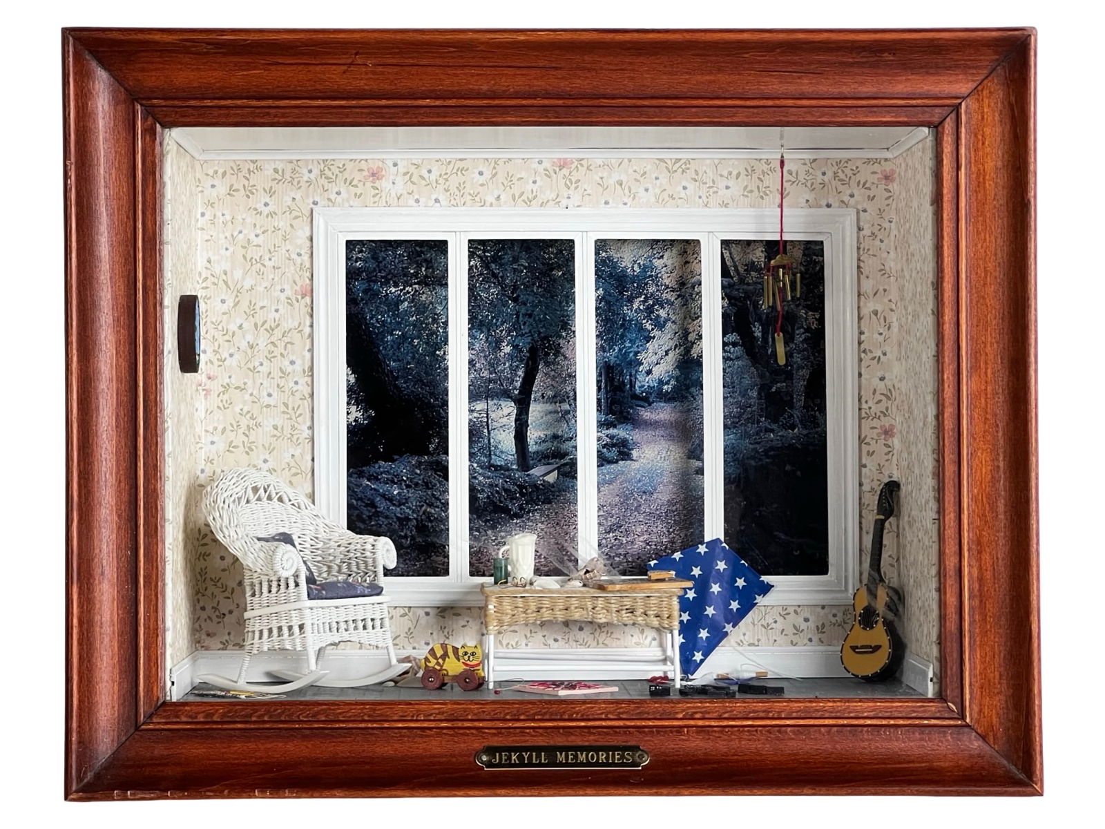 "Jekyll Memories" Miniature Shadow Box Diorama: Charming three-dimensional shadow box diorama titled "Jekyll Memories," presented in a richly stained wood frame with brass nameplate. The detailed interior scene depicts a cozy room with floral