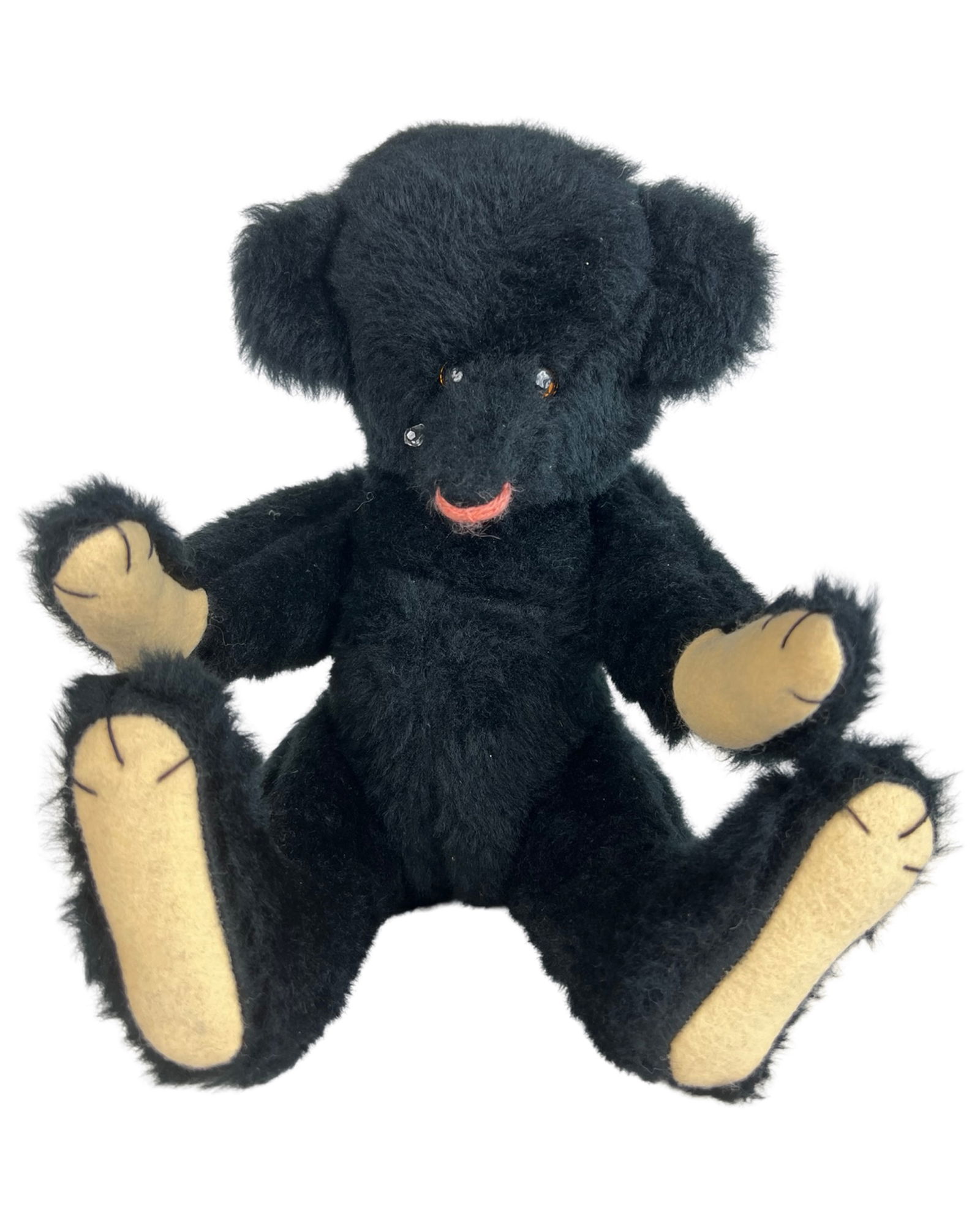 Louis Beck Artist Black Mohair Teddy Bear: Charming artist-made black mohair teddy bear by Louis Beck, signed and dated 1988 on the sewn tag. This expressive handcrafted bear features rich black mohair, contrasting tan felt paw pads, and a