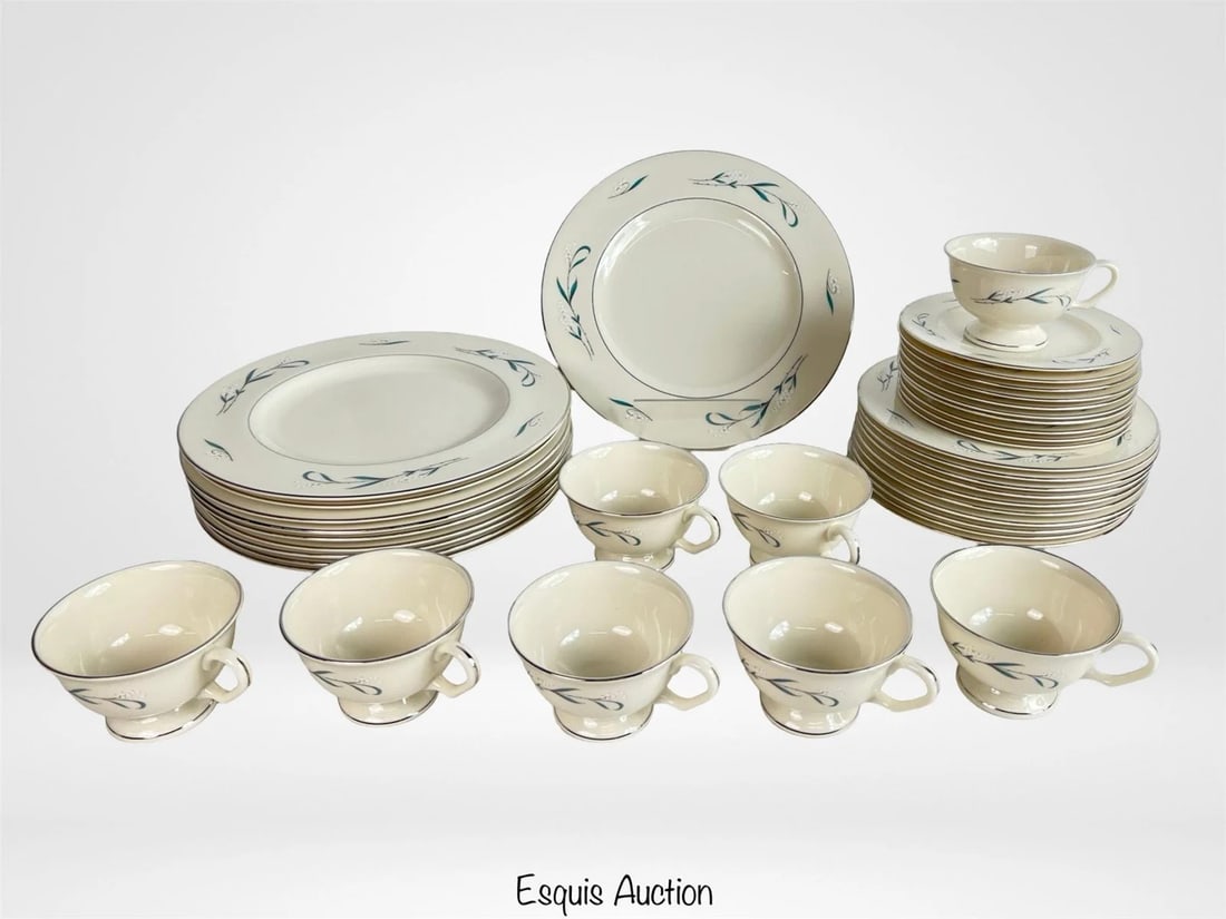 Pickard "Snowberry" Fine China Service Set: Elegant and understated, this Pickard China "Snowberry" pattern service set for 8 features a delicate white floral motif with sage green leaves and silver-tone trim on creamy ivory porcelain. Made in