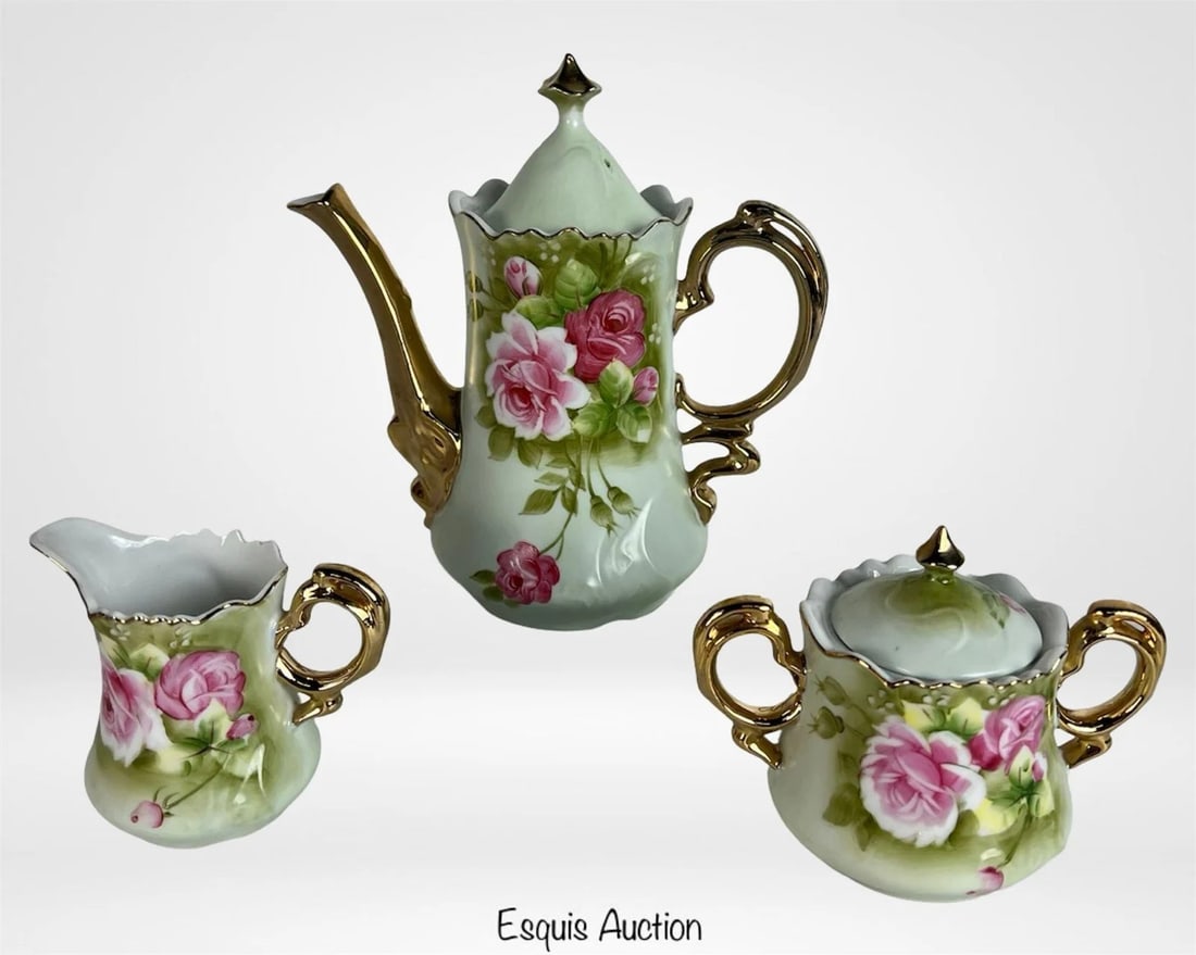 Lefton China "Heritage Green" Rose Tea Set: Lovely vintage Lefton China "Heritage Green" tea set featuring hand painted pink roses on soft green porcelain with elegant gold-tone handles and trim. Includes the teapot (8 3/4" tall), matching lidd