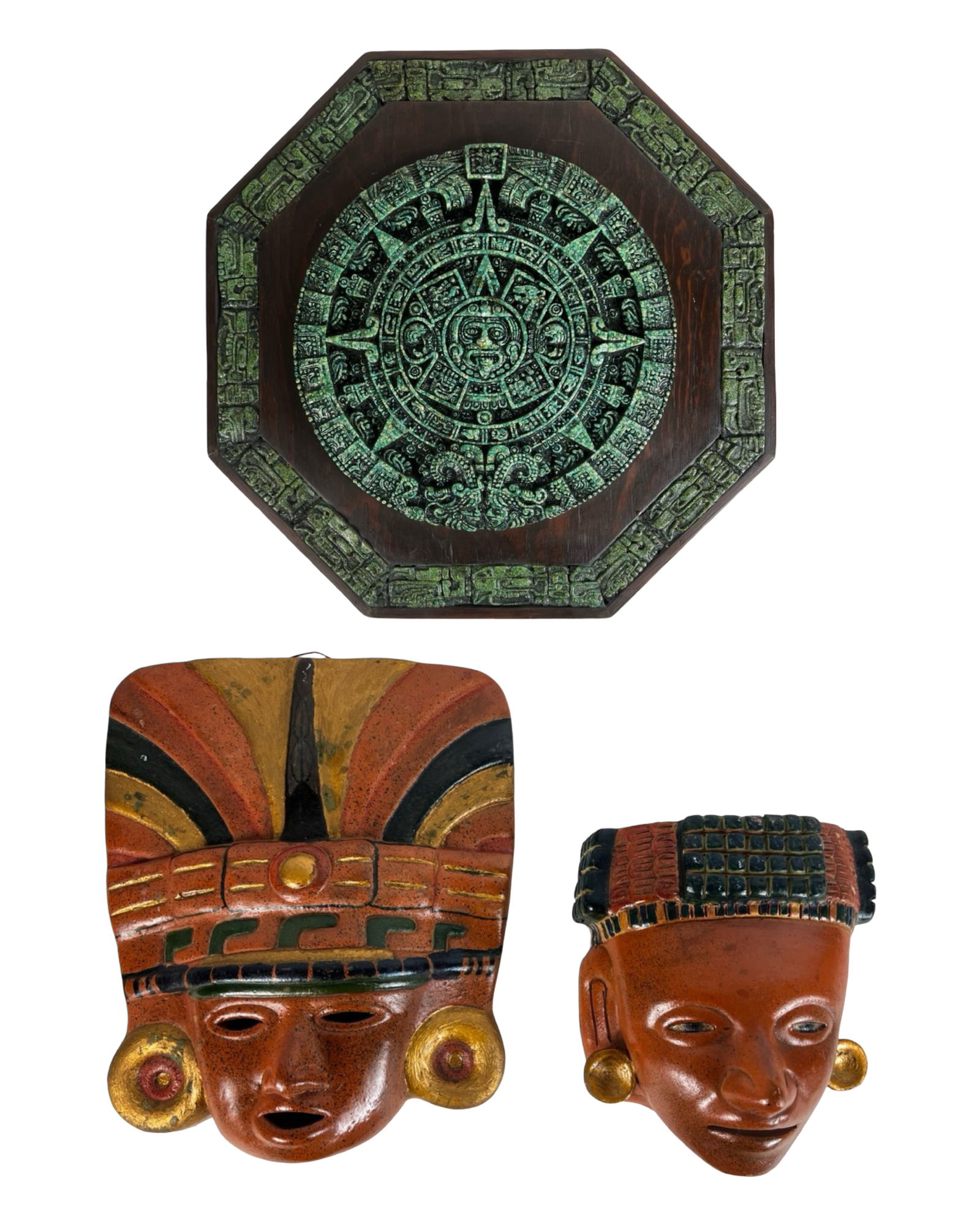 Aztec / Mayan Style Calendar Wall Plaque & Masks: Decorative wall art group featuring an Aztec/Mayan-style calendar plaque and two figural masks inspired by pre-Columbian Mesoamerican designs. The plaque displays a detailed relief interpretation of t