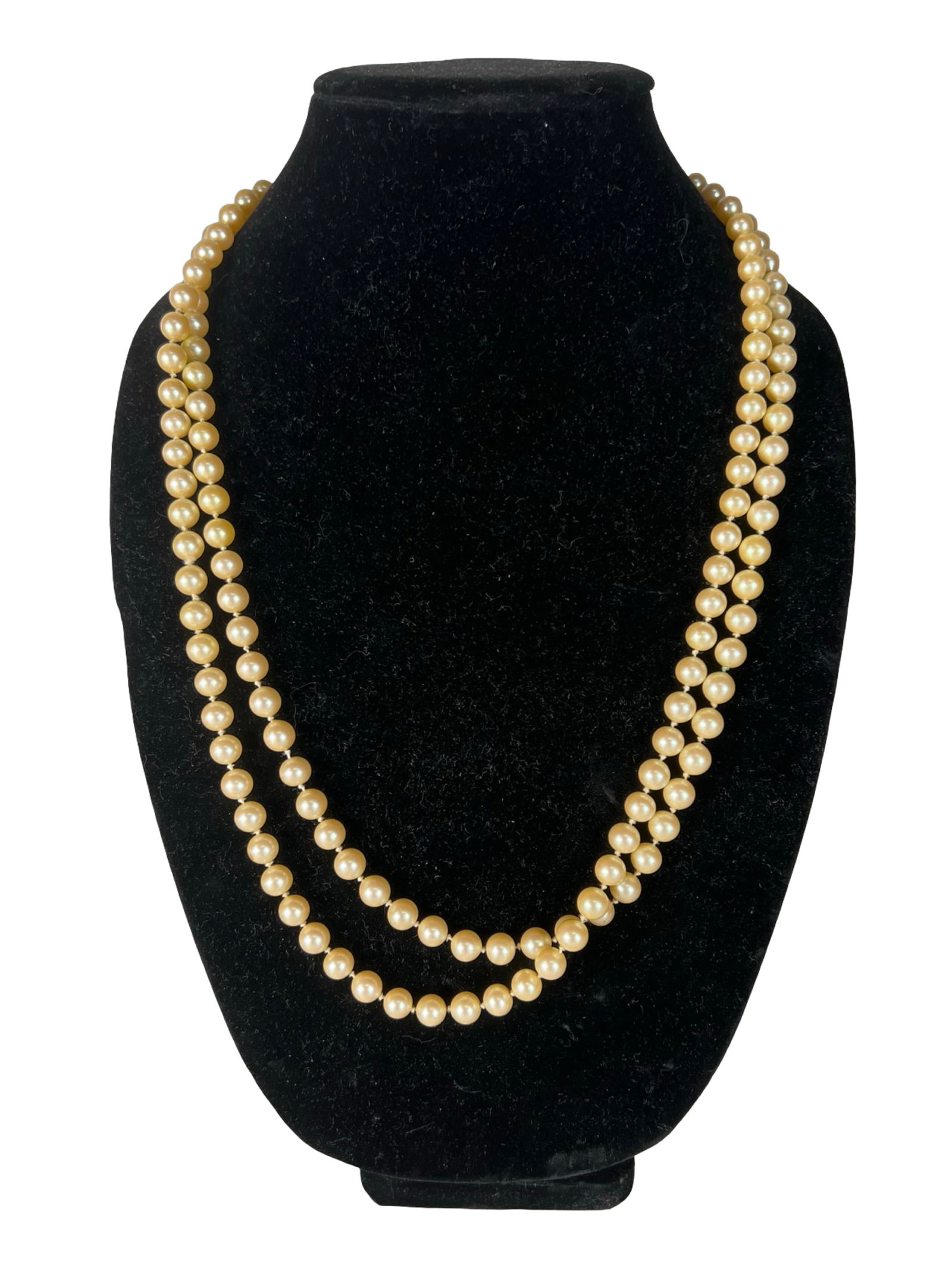 Long Genuine Pearls Necklace: Classic long strand of genuine pearls featuring warm cream-colored pearls with a soft, natural luster. The necklace is composed of uniformly sized pearls that create an elegant and timeless appearance