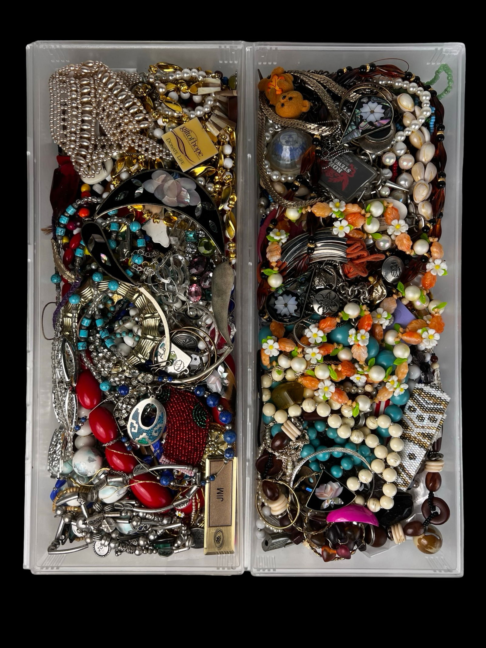 Assortment of Unsearched Costume & Craft Jewelry: Mixed assortment of unsearched costume and craft jewelry including necklaces, bracelets, pendants, beads, brooches, and assorted jewelry components. The lot contains a colorful variety of materials