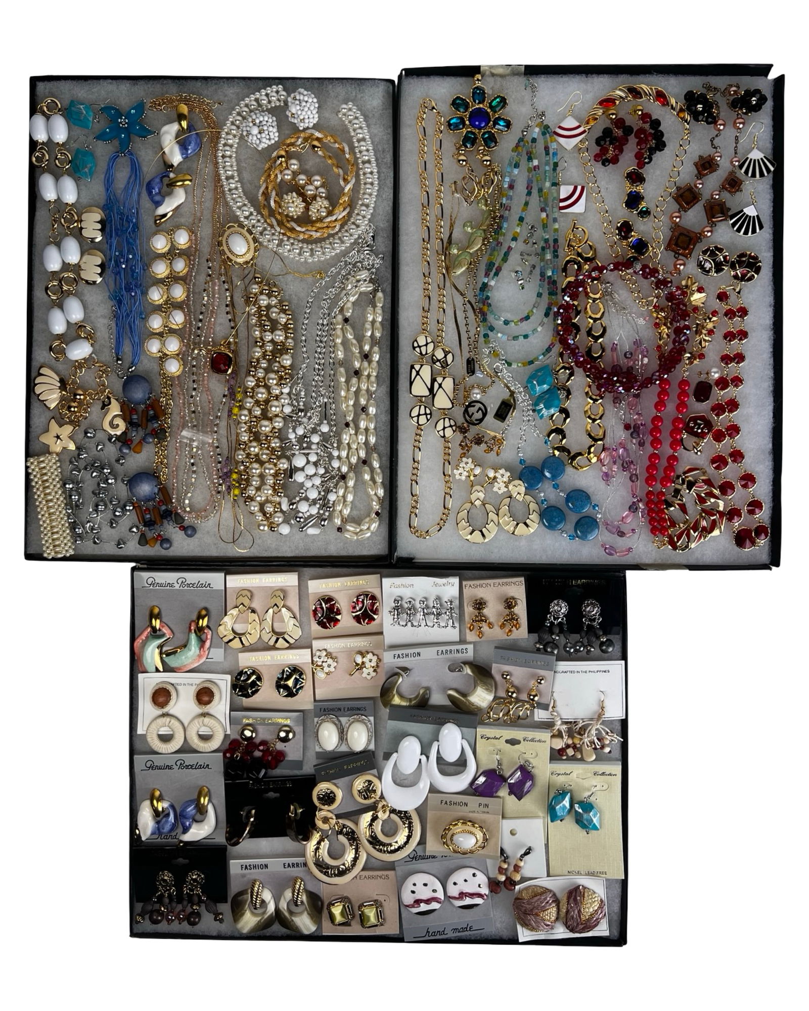 Colorful & Sparkling Assortment of Costume Jewelry: A colorful and sparkling assortment of costume jewelry featuring a mix of necklaces, earrings, bracelets, and other stylish accessories. This diverse grouping offers plenty of shine and versatility,