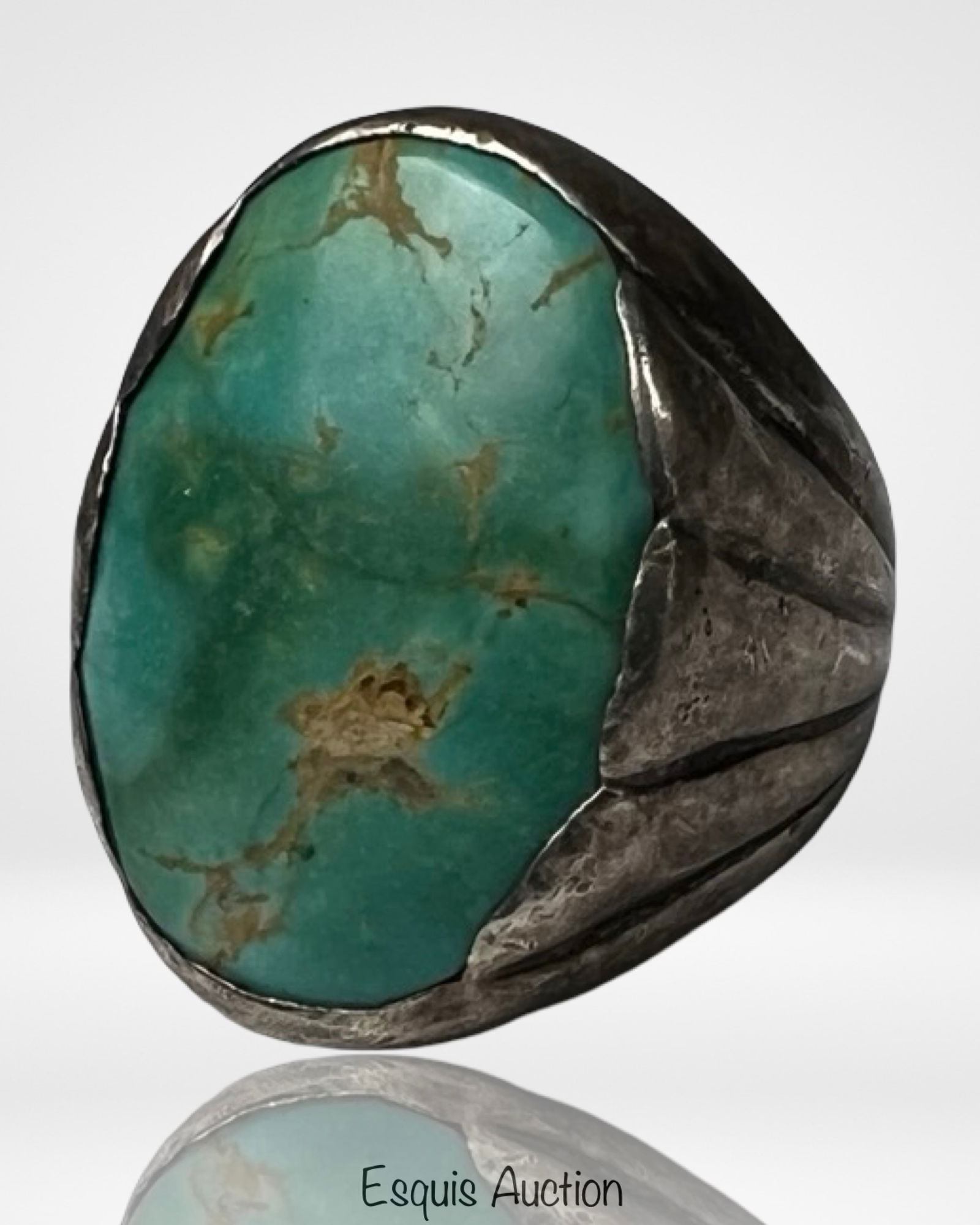 Bell Trading Post Sterling Silver Turquoise Ring: Impressive vintage 1930s Bell Trading Post sterling silver and turquoise ring featuring a large natural turquoise cabochon set in a heavy handcrafted silver mounting. The stone displays a rich