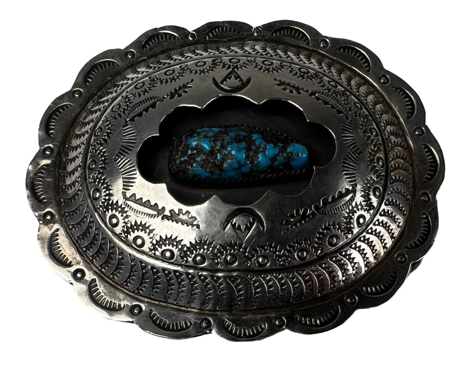 Navajo Sterling Silver Turquoise Belt Buckle: Striking Navajo sterling silver belt buckle featuring an impressive hand-stamped design and a prominent natural turquoise cabochon set at the center. The stone displays vibrant blue coloration with