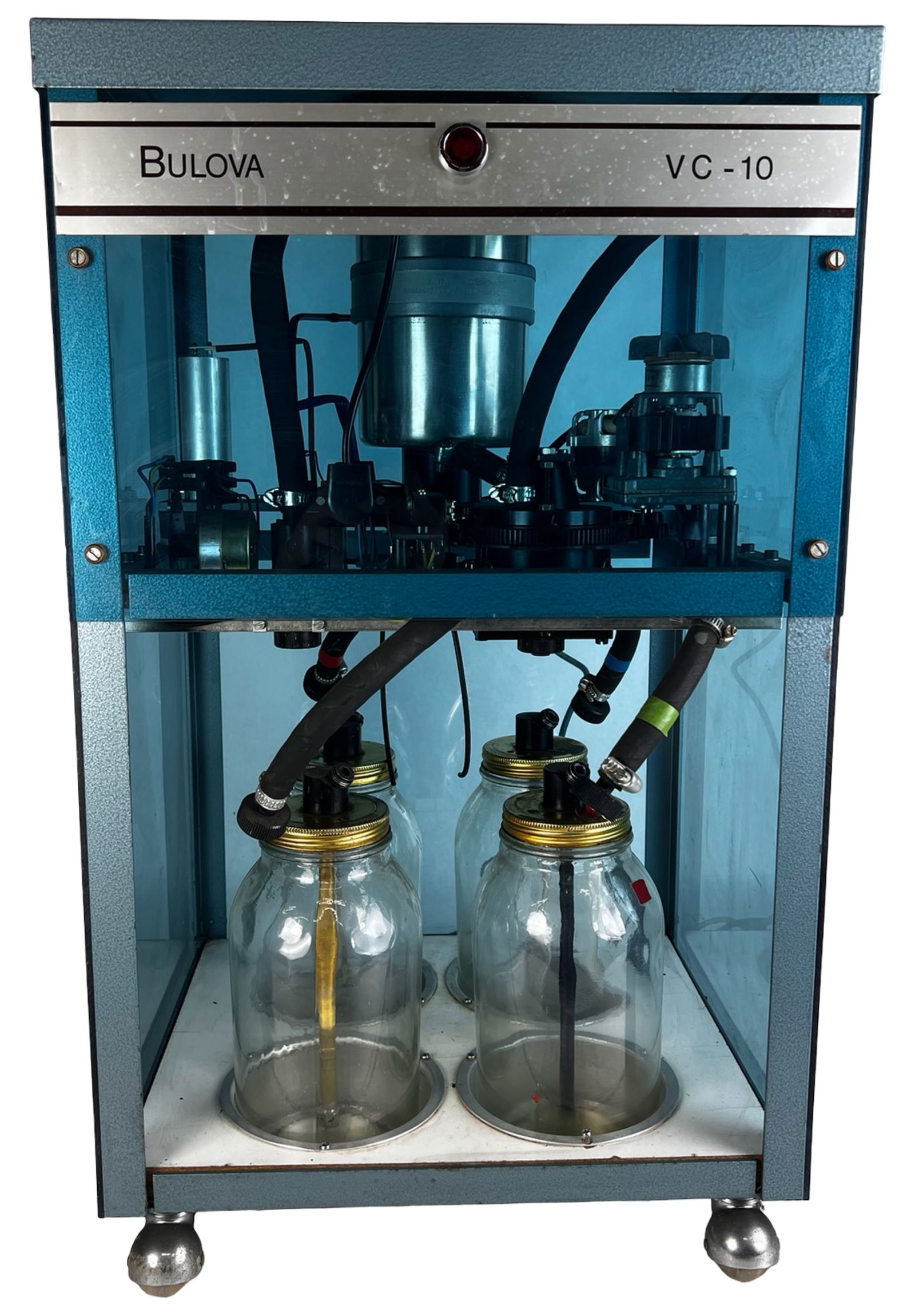 Bulova VC-10 Watch Cleaning Machine: Vintage Bulova VC-10 watch cleaning machine, a professional watchmaker's tool used for cleaning and servicing mechanical watch movements. The unit features the original glass cabinet, internal