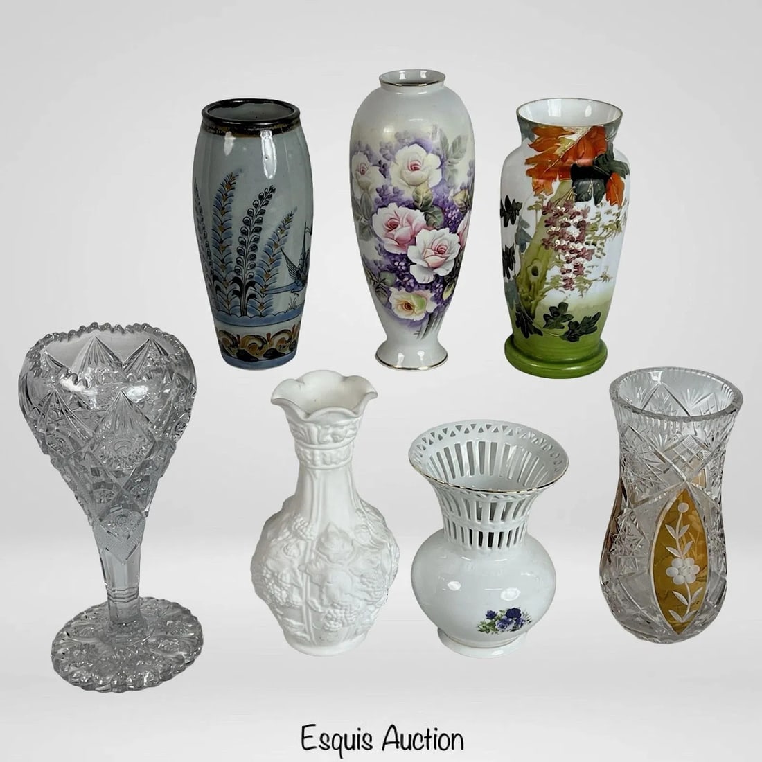 Group of 7 Decorative Vases - Glass, Porcelain, Po: This elegant and varied group includes a hand-painted Art Nouveau glass vase featuring a lush landscape scene, as well as a richly cut clear crystal trumpet vase. Also featured is a Bohemian amber-to-